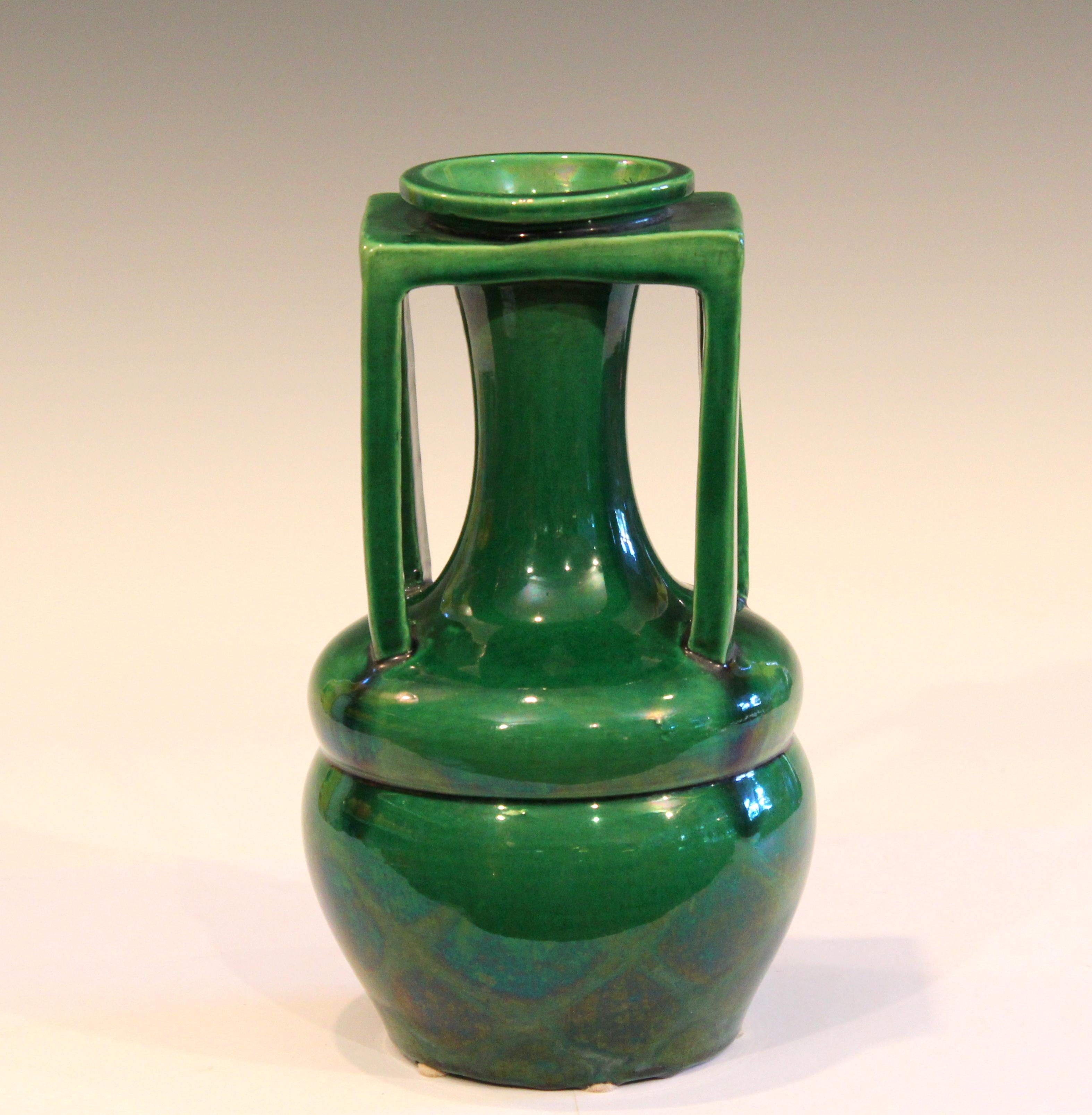 Vintage Awaji vase in terrific organic form with four architectural handles and rectangular collar supporting the elongated neck. With deep green monochrome glaze, circa 1920s. Measures: 10