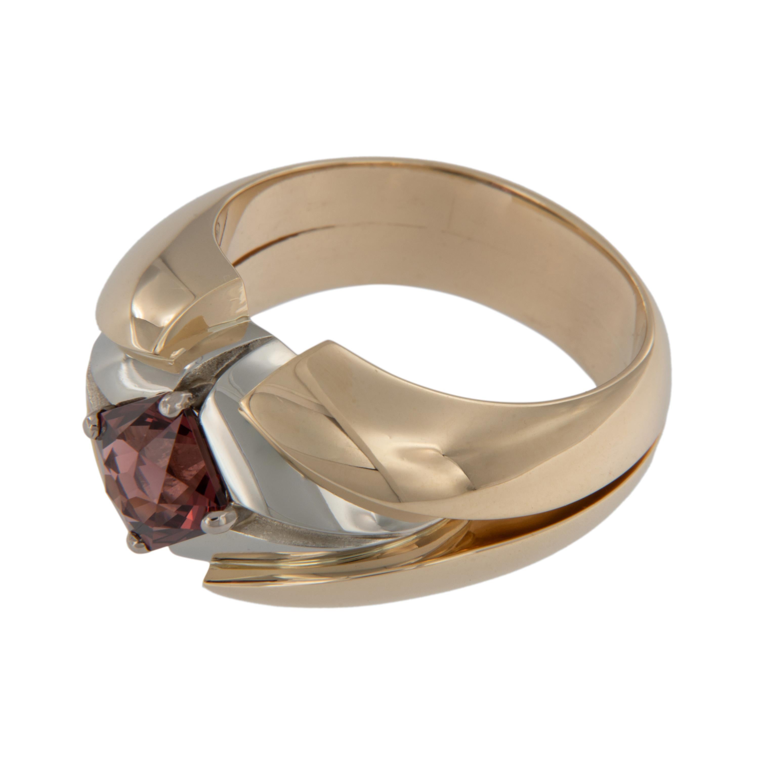 Phillip Youngman has a way to make gemstone's come to life like no other and this spinel is a shining example! Crafted in rich 18 karat white & 14 karat yellow gold this ring by Yanke Designs showcases the 2.36 Carat gem orange/red spinel perfectly.