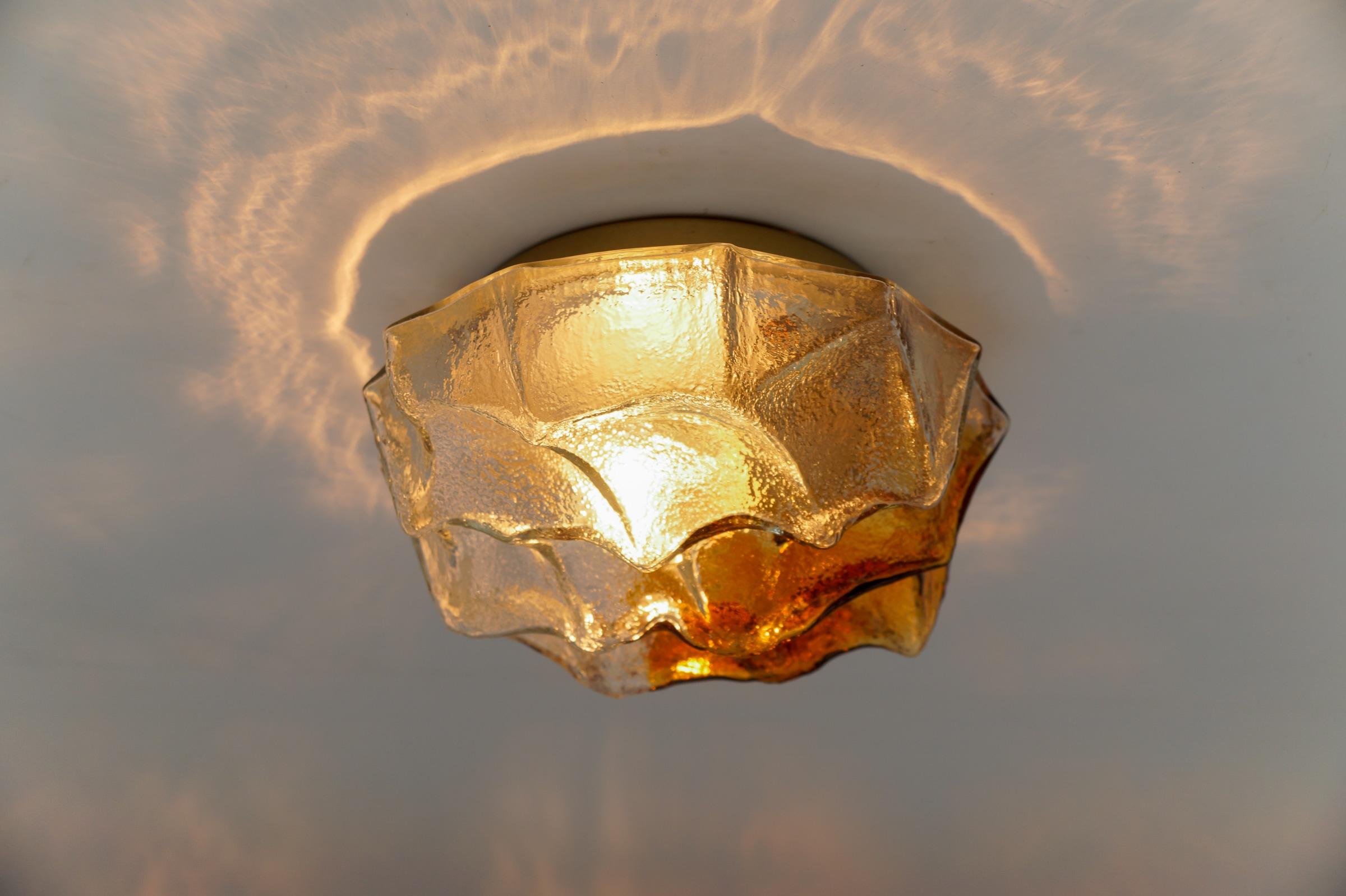 Awesome Flush Mount in Bicolor Glass, 1960s

Dimensions
Height: 4.33 in. (11 cm)
Width: 9.84 in. (25 cm)

The fixture need 1 x E27 standard bulb with 60W max.

Light bulbs are not included. 
It is possible to install this fixture in all countries
