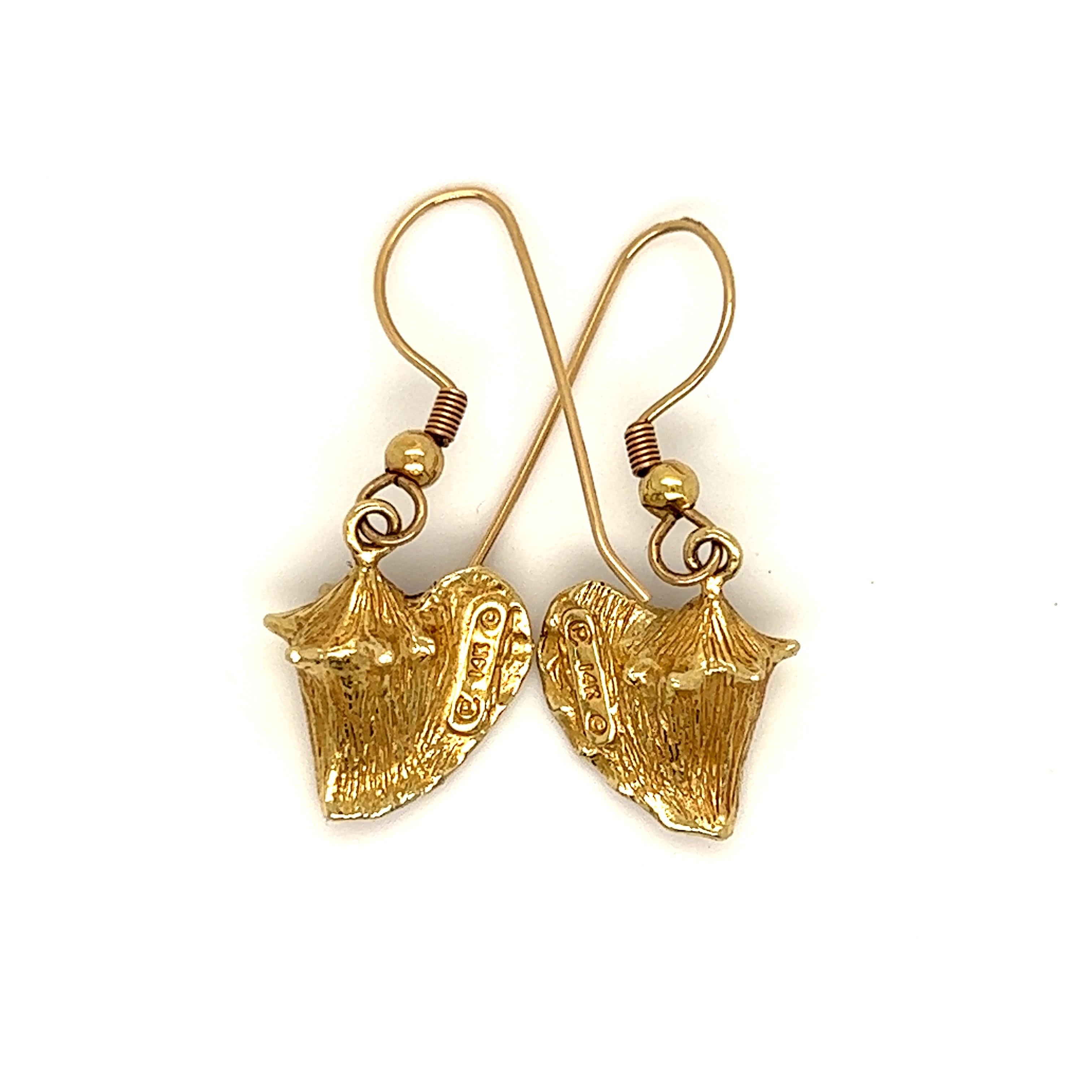 So so Awesome!  These Vintage 14K Yellow Gold Enamel Dangle Earrings are amazing! Crafted in 14K Yellow Gold, each earring features a highly details conch shell motif, with beautifully done enamel work. I've never seen another pair like it.