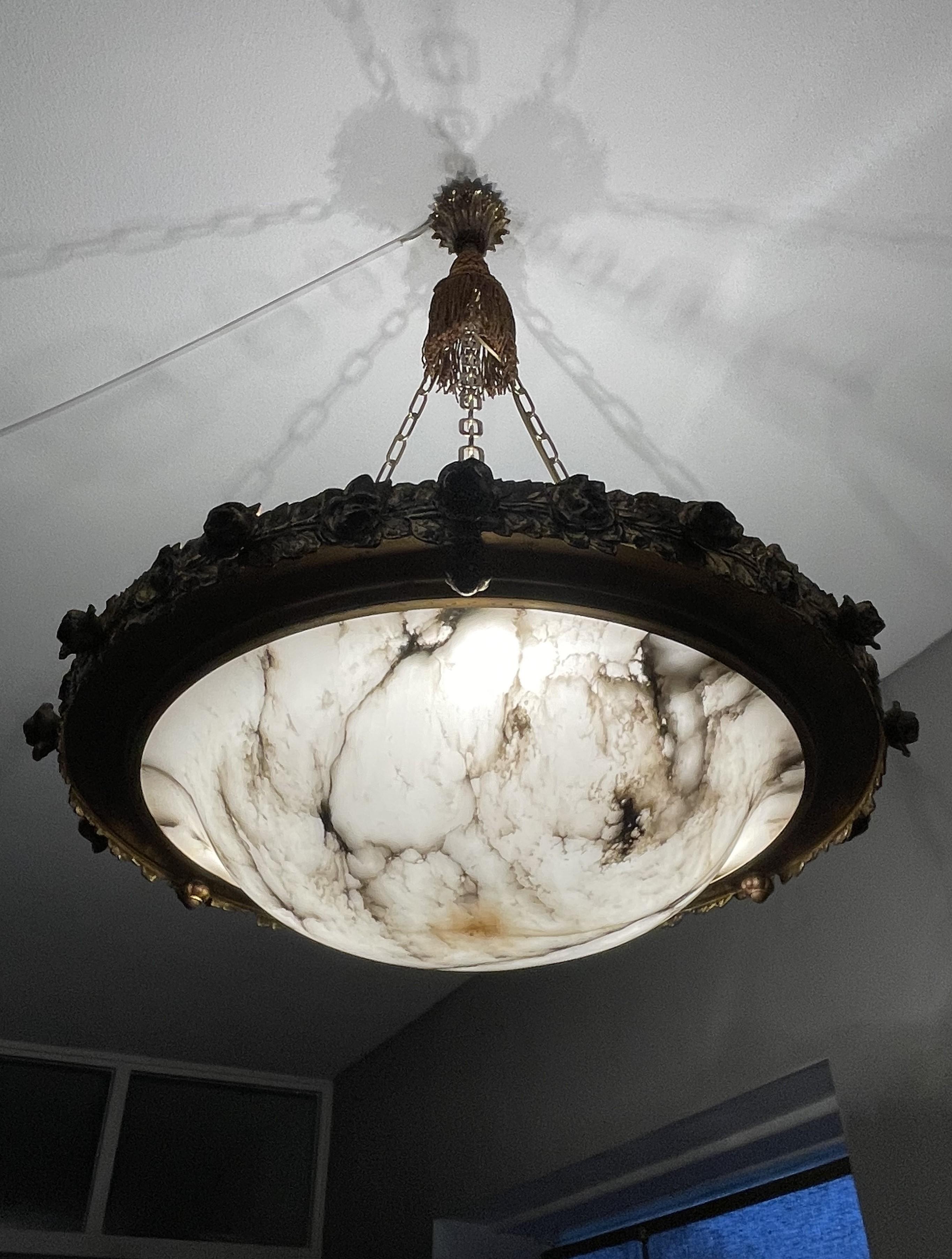 One of our largest and most stylish ever, alabaster and bronze pendant lights.

This one of a kind and extra large alabaster light fixture also is one of the best designs we ever sold. The beautiful and hand-polished surface of this alabaster shade