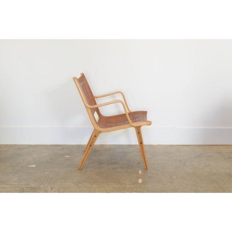 Ax lounge chair by Peter Hvidt & Orly Mølgaard-Nielsen

MFG: Fritz Hansen c. 1954 Denmark

Materials: Laminated beech, leather & teak. Character enhanced by patina and wear. scratch on top of one arm. 

Approx dimensions: 31
