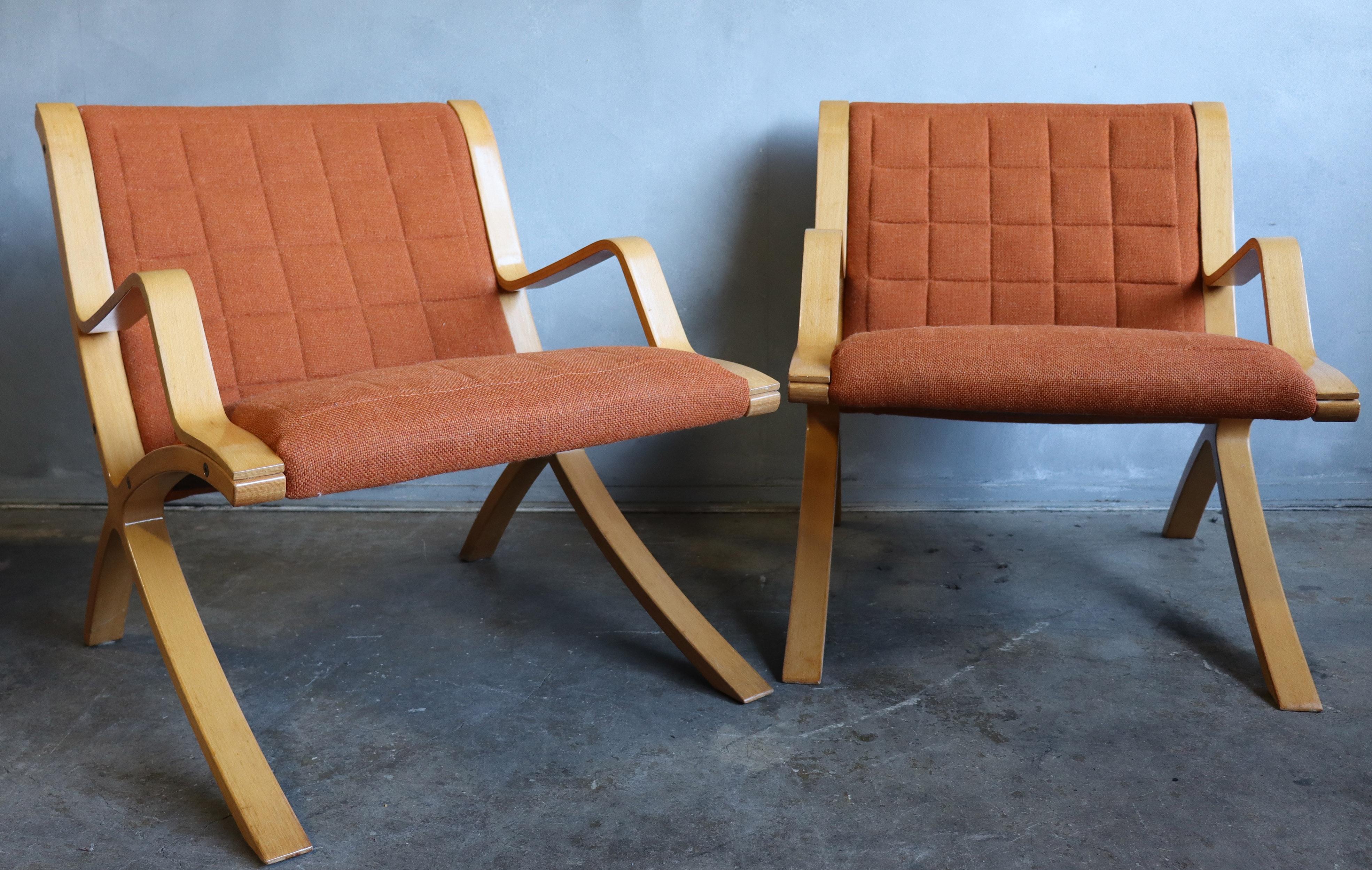 For your consideration are these spectacular Ax lounge chairs in original condition featuring bent wood frames and original burn orange tufted wool upholstery. Very comfortable and striking design.