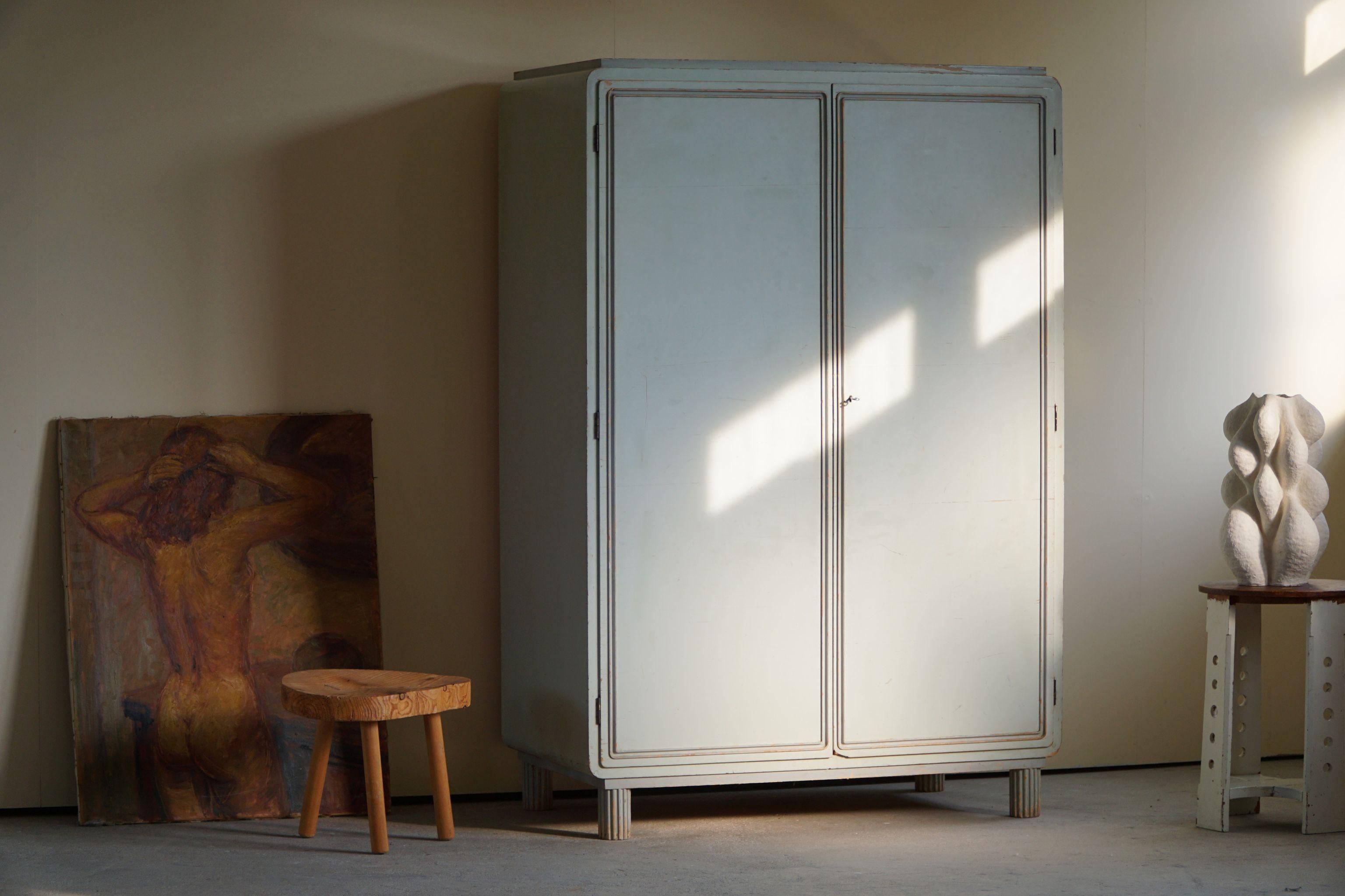 Very rare mint blue pastel painted Art Deco Cabinet in birch. Designed by Swedish Designer Axel Einar Hjorth, model 