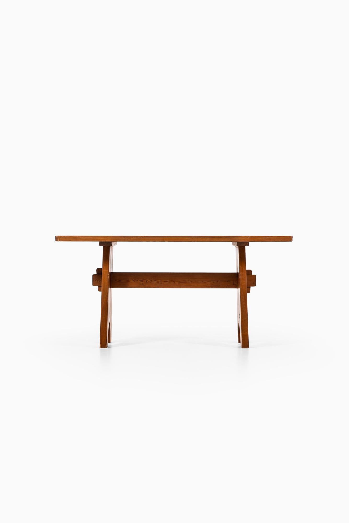 Rare dining table in the manner of Axel Einar Hjorth. Produced in Sweden.