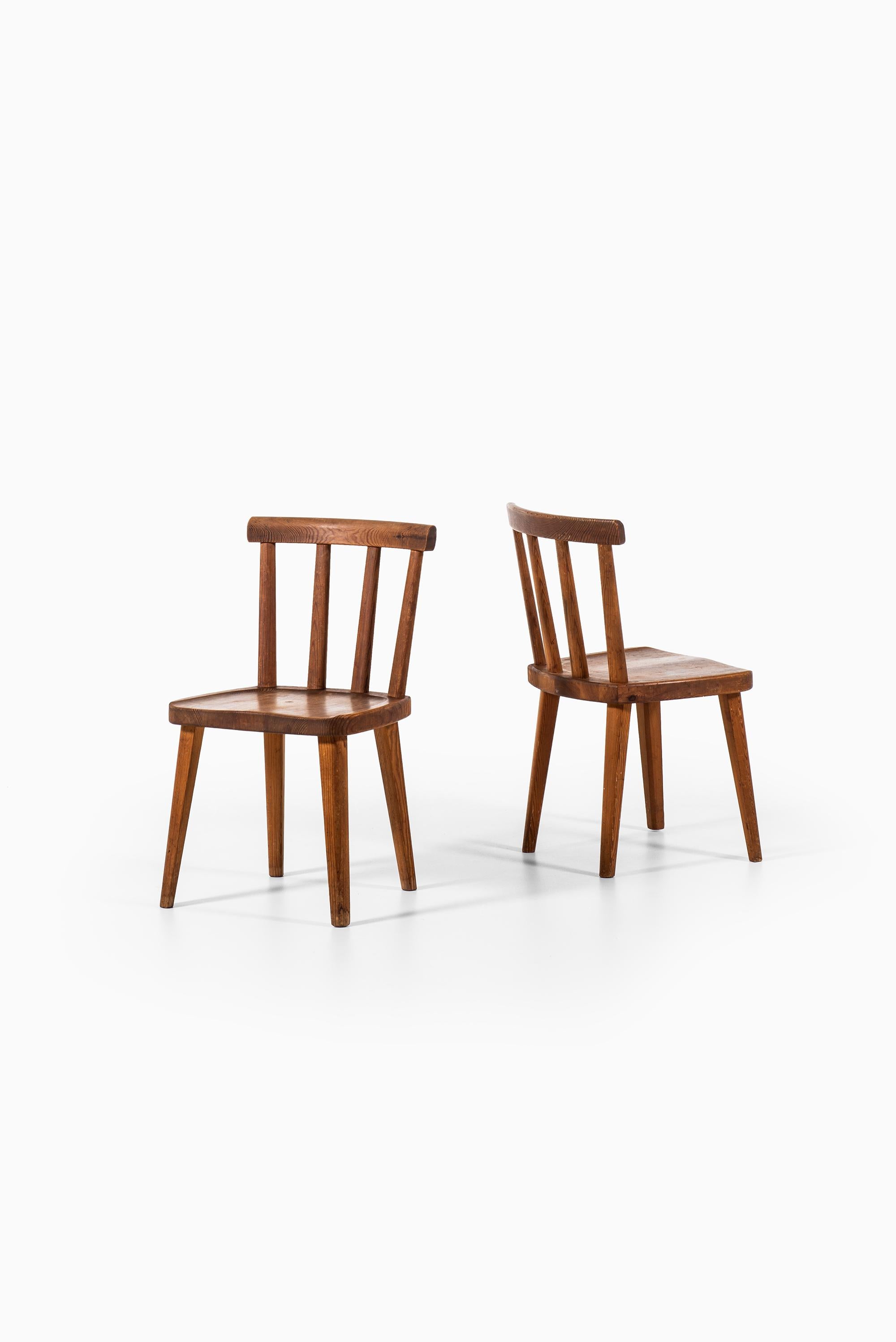 Rare set of 6 dining chairs model Utö designed by Axel Einar Hjorth. Produced by Nordiska Kompaniet in Sweden.