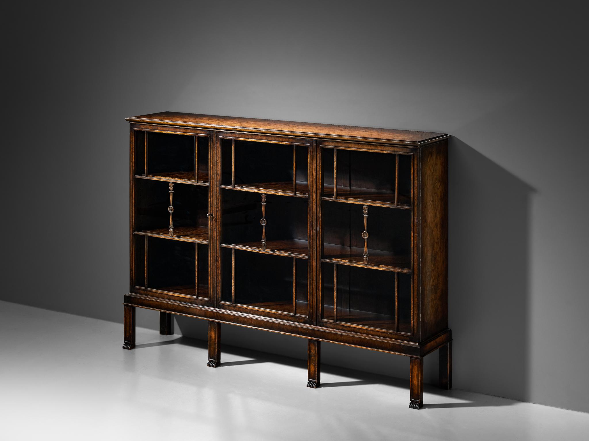 Axel Einar Hjorth for Nordiska Kompaniet, bookcase, stained birch, glass, Sweden, 1927

In 1927, Axel Einar Hjorth unveiled a masterpiece for Nordiska Kompaniet – a bookcase that embodies the epitome of Swedish design. The bookcase is crafted from