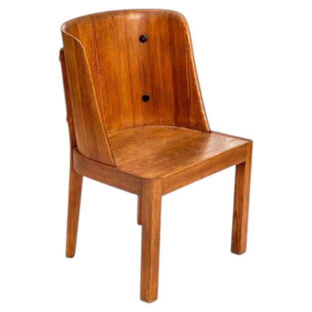 Axel Einar Hjorth "Lovo" armchair, stained pine and iron rivets For Sale