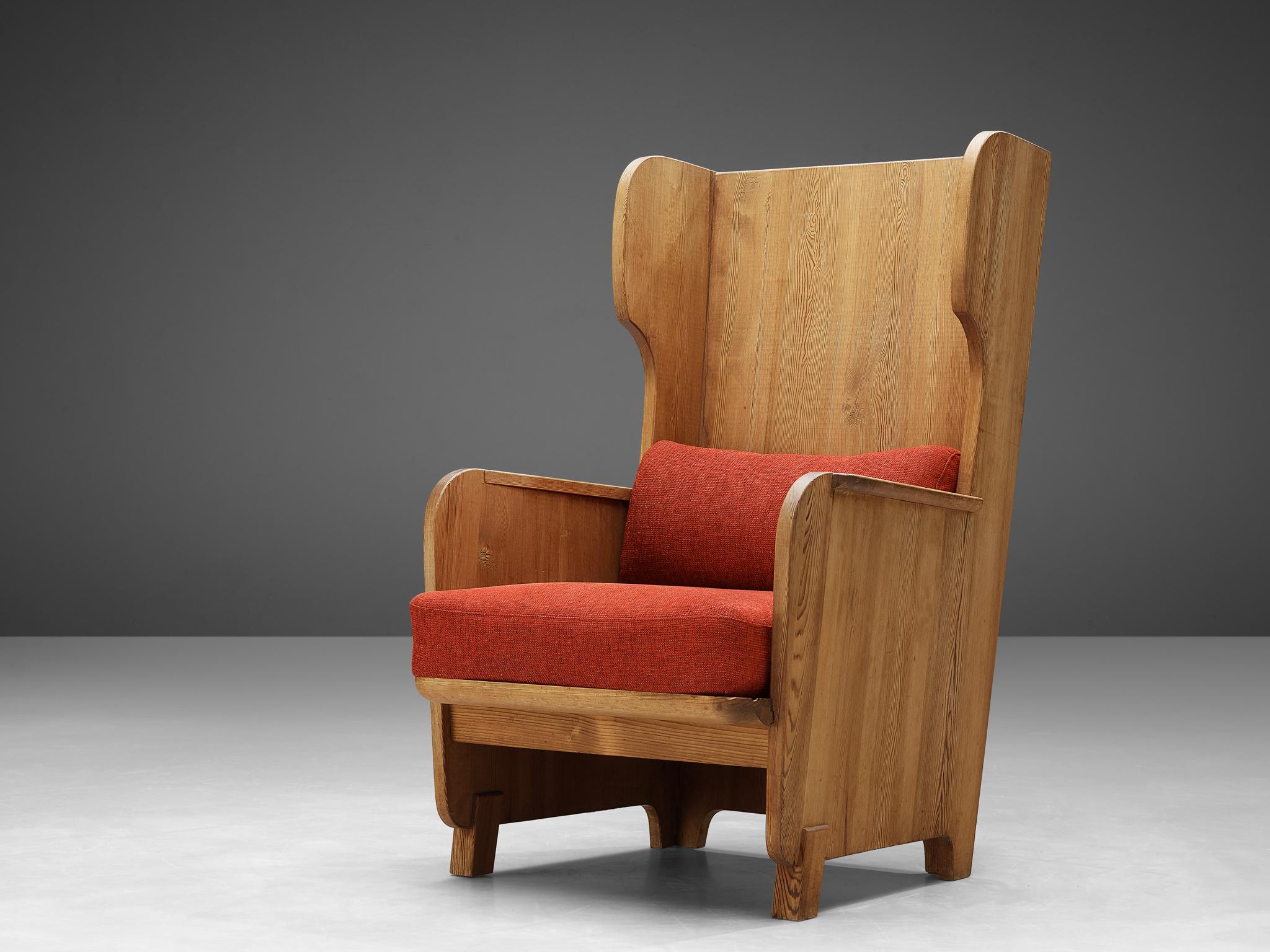 Axel Einar Hjorth, wingback lounge chair model 'Lovö', pine, red fabric, Sweden, 1932

Sturdy high back ‘Lovö’ chair in solid pine by Axel Einar Hjorth. This chair has all classical elements of a wingback chair, yet due the execution in natural