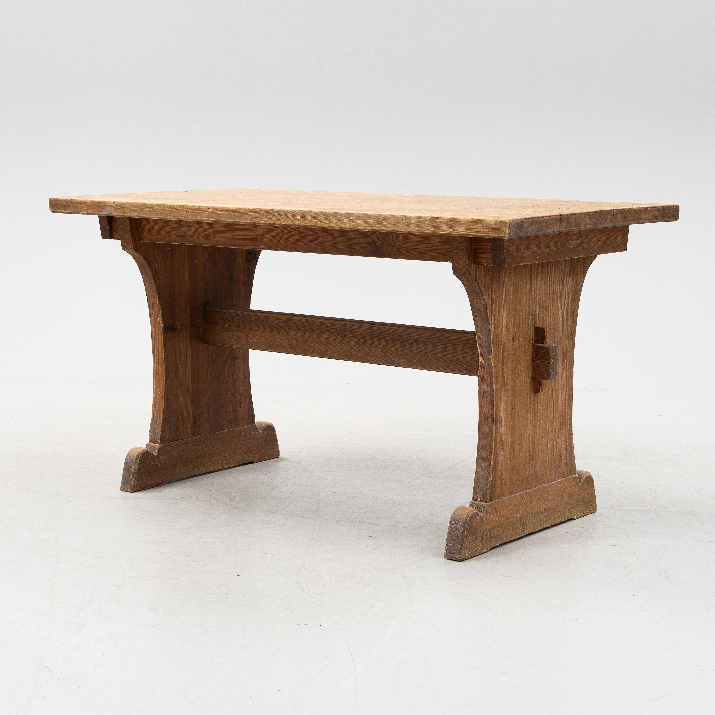 Rare dining / console table in solid stained pine designed by Axel Einar Hjorth and produced for Nordiska Kompaniet in Stockholm during the 1930s. In good vintage and original condition with signs from age and use. 

Dimensions: H: 74 cm W: 140 cm