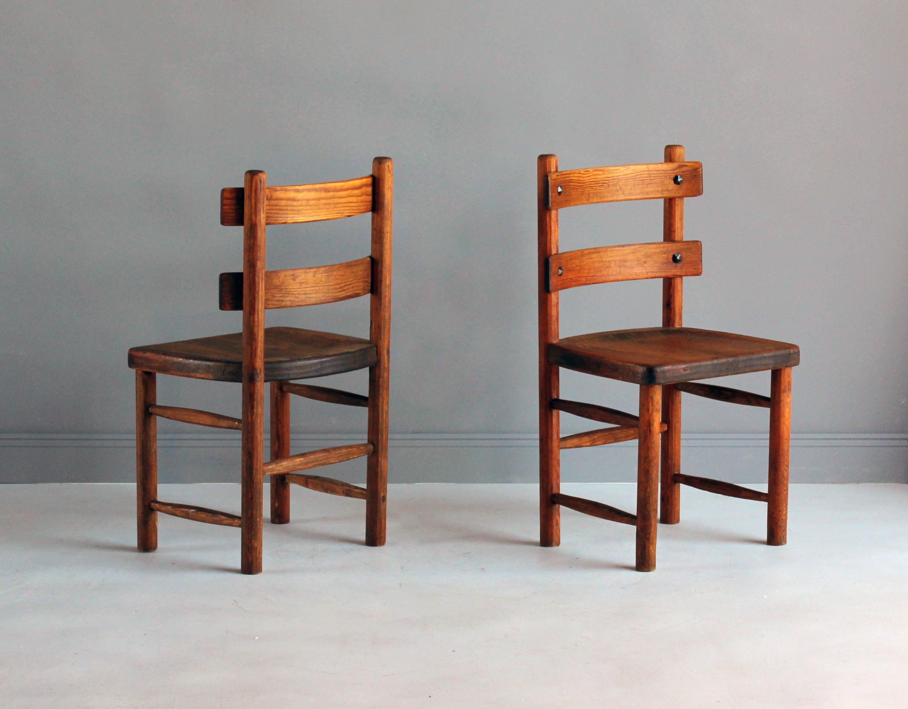 A pair of side chairs by Swedish architect and designer, Axel Einar Hjorth, produced by Nordiska Kompaniet in the early 1930s. Named 
