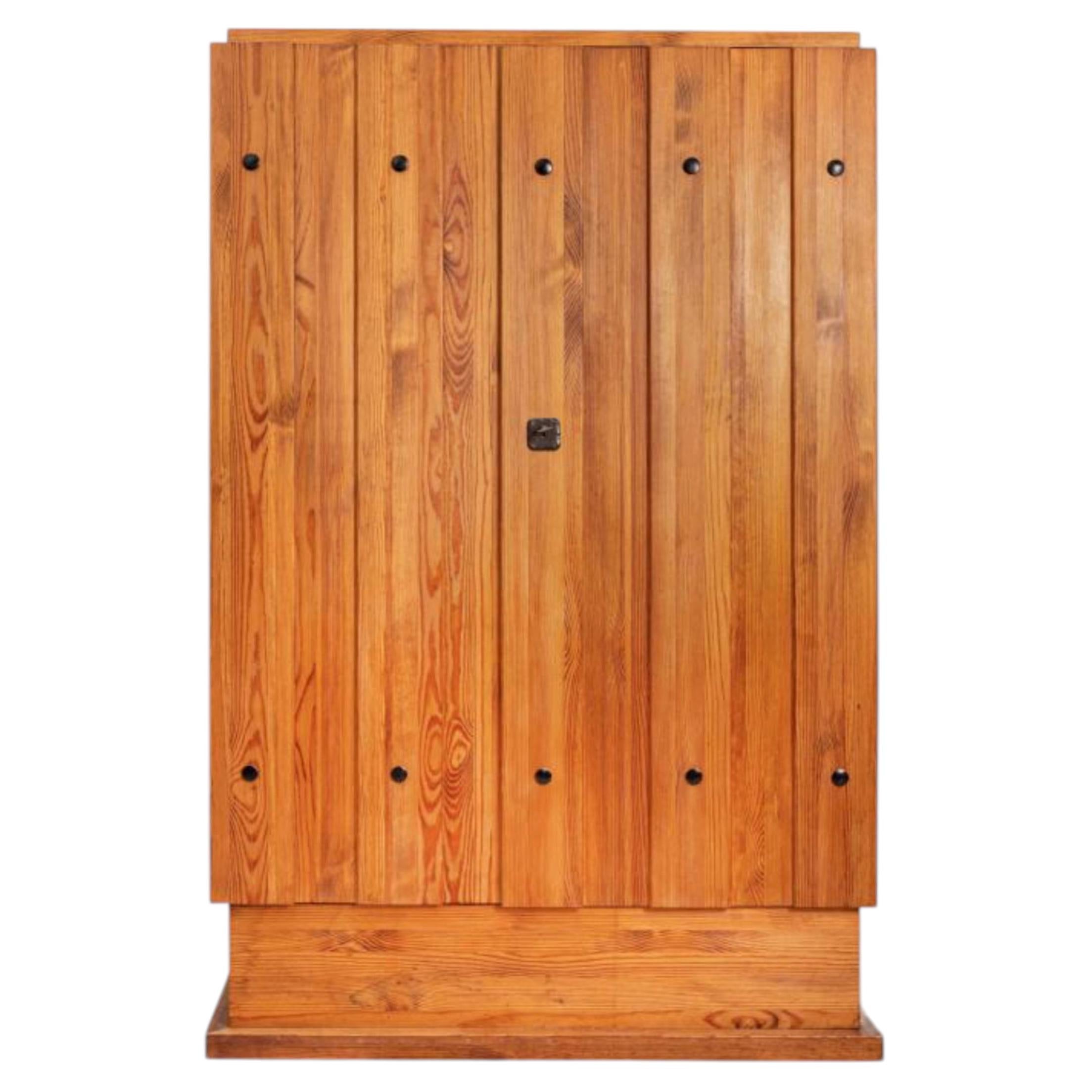 Axel Einar Hjorth Rare "Lovö" cabinet in stained pine wood For Sale