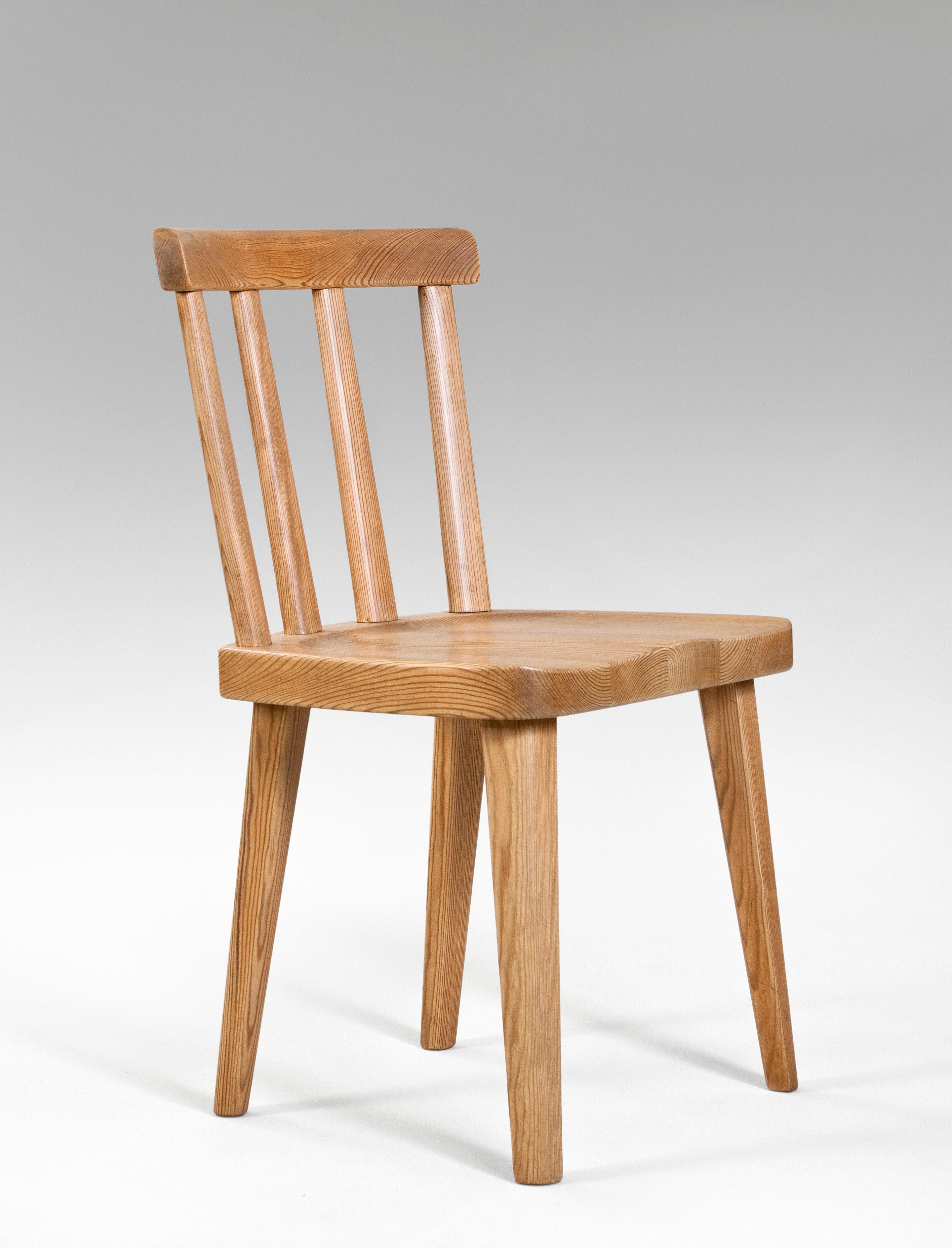 Axel Einar Hjorth, for Nordiska Kompaniet, 
Set of 6 Swedish Solid Pine Utö chairs
circa 1930
The concave top rail raised on four rounded back splats, above a contoured seat, terminating in tapering rounded legs. In great overall antique