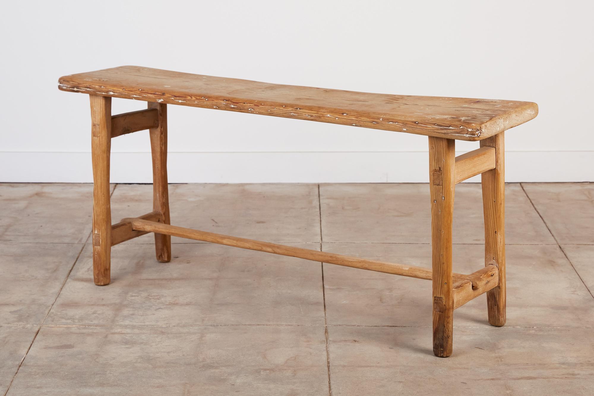 Axel Einar Hjorth style console table. The table features a patinated pine base and legs with a horizontal stretcher connecting the legs and visible joinery throughout.

Dimensions: 65.5” width x 15.75” depth x 29” height

Condition: Good