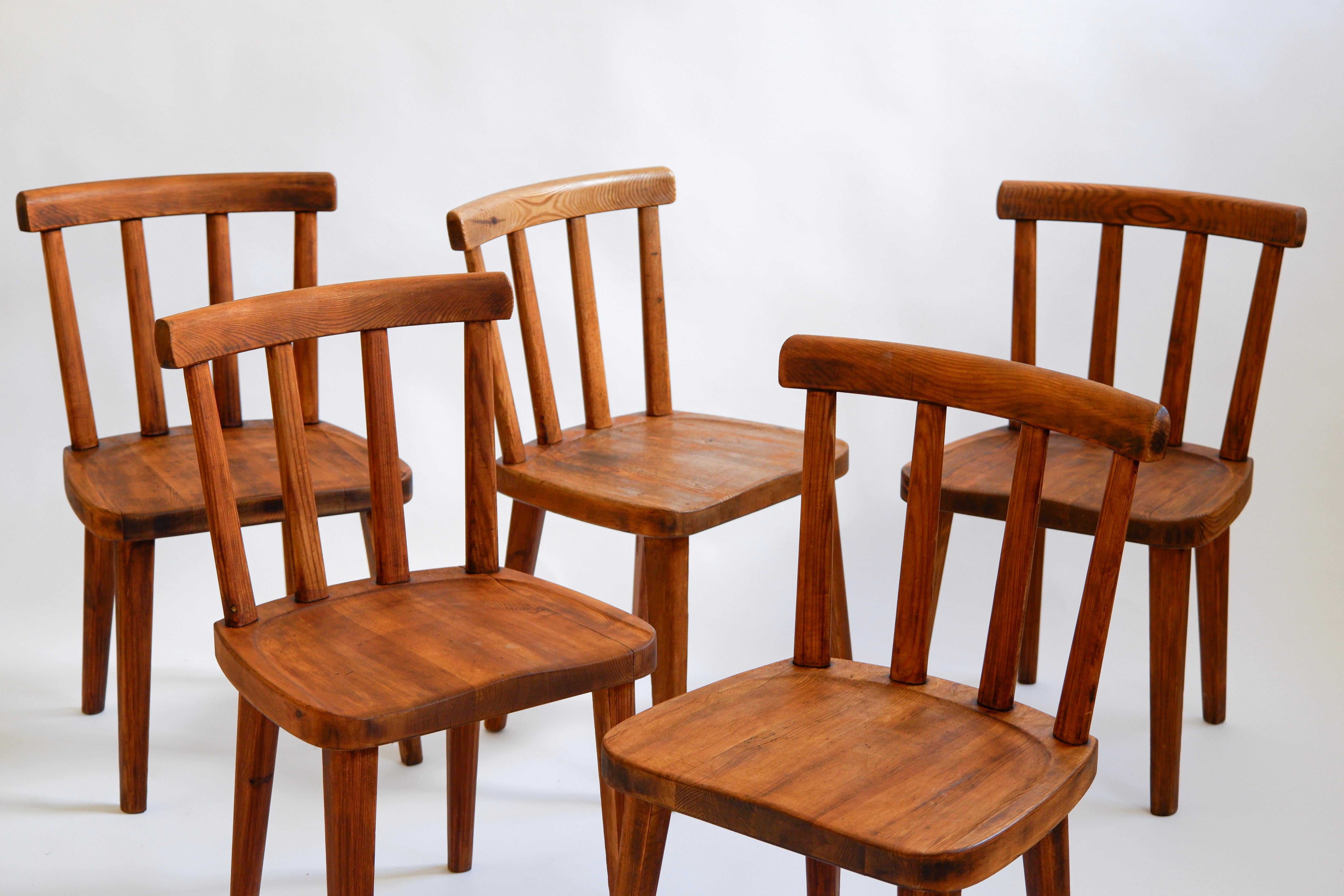 Authentic Axel Einar Hjorth set of 5 utö chairs designed in 1932 and produced during the 30's by Nordika Kompaniet. The chair is in good condition overhall, stable, with an authetic and untouched patina. The chairs are made in solid pine, a true