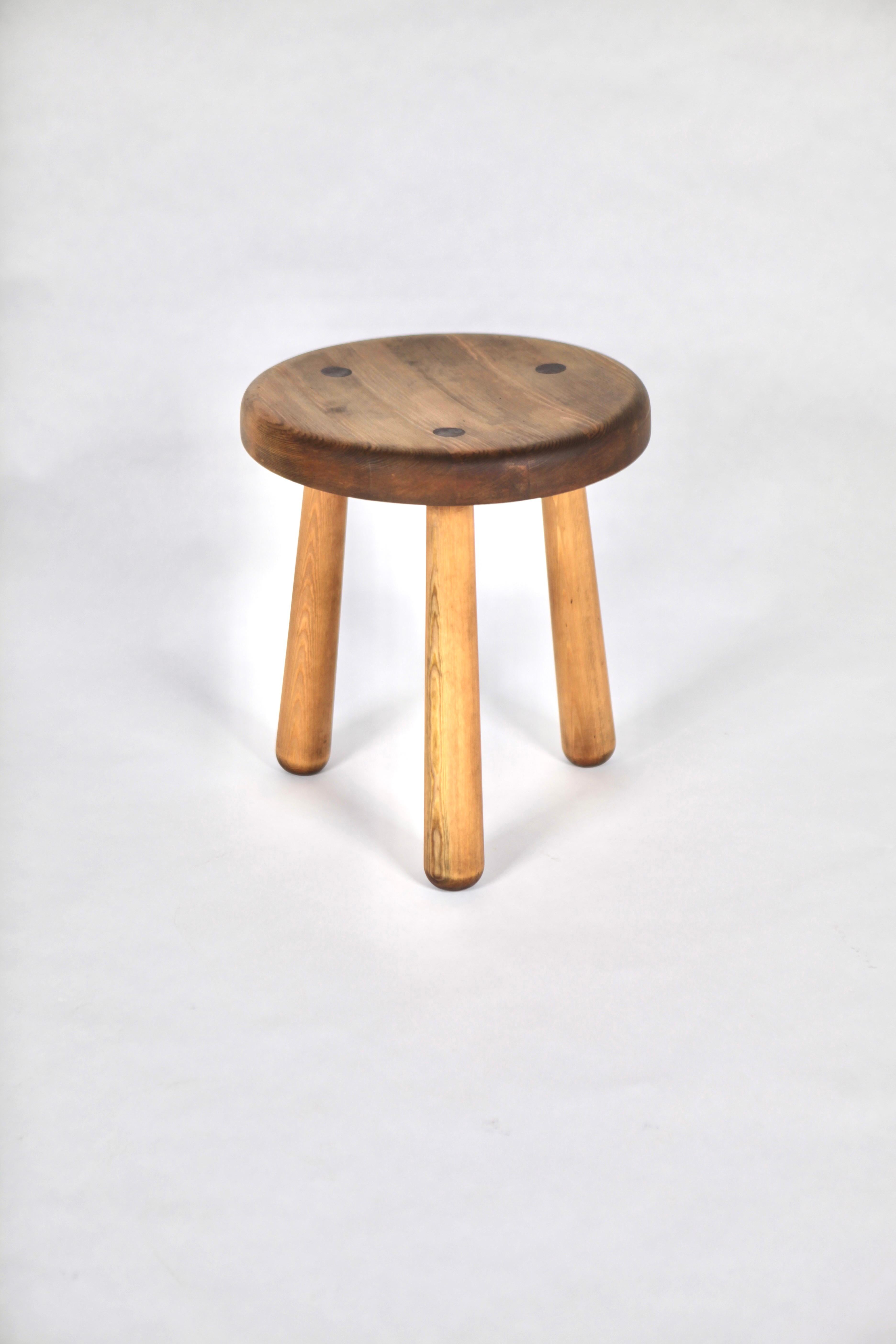 Axel Einar Hjorth, stool, model 'Utö'. 
Solid acid stained Nordic pine.
Executed by Nordiska Kompaniet in Sweden. Designed in 1932.
Iconic design from the 'sports cabin' series named after the Stockholm archipelago region.

