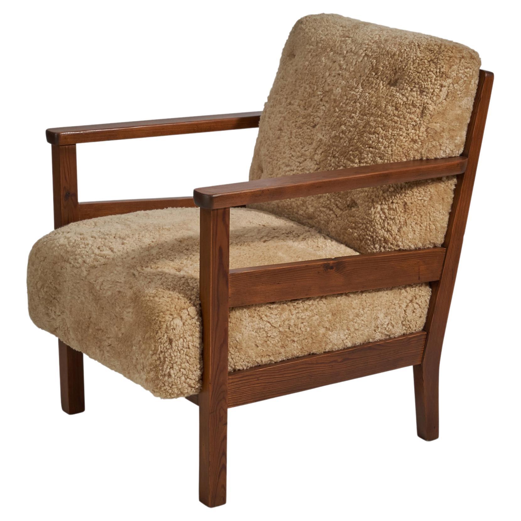 Axel Einar Hjorth, "Wärmdö" Lounge Chair, Pine, Shearling, NK, Sweden, 1942 For Sale