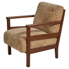 Vintage Axel Einar Hjorth, "Wärmdö" Lounge Chair, Pine, Shearling, NK, Sweden, 1942