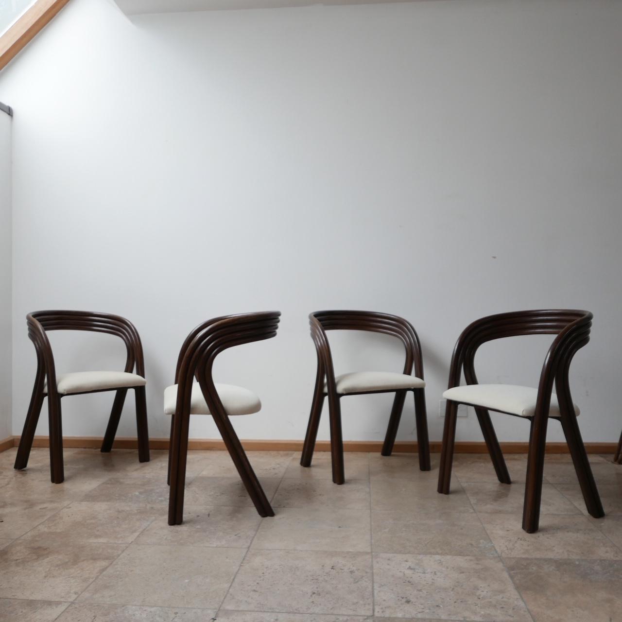 A set of four stylish dining chairs by Axel Enthoven for Rohé. 

Holland, c1970s. 

Steam bent wood. 

Upholstered in a neutral fabric. 

Location: London Gallery. 

Dimensions: 53 W x 42 D x 45 seat height x 77 total height in cm.