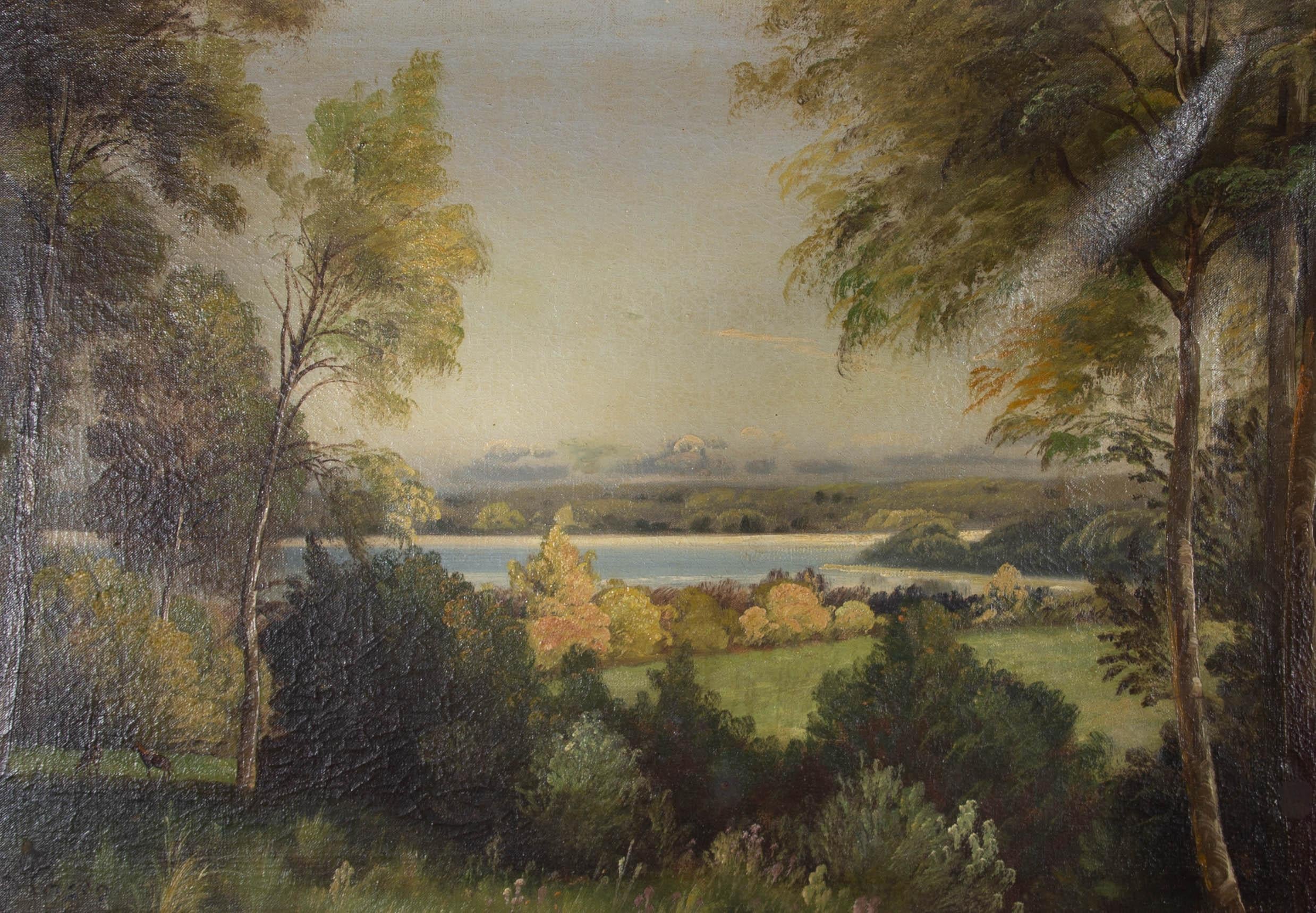A charming landscape scene by Danish artist Axel Johansen. Depicting a calm lake in a forest setting with two deer grazing to the left hand side of the composition. Signed to the lower left. Presented in a substantial gilt frame with a decorative