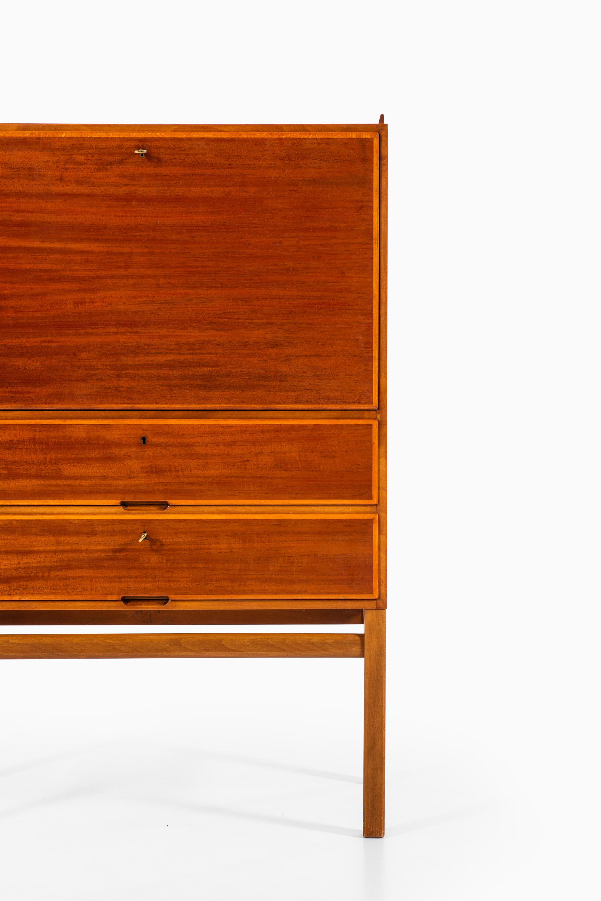 Rare cabinet with desk designed by Axel Larsson. Produced by Bodafors in Sweden.