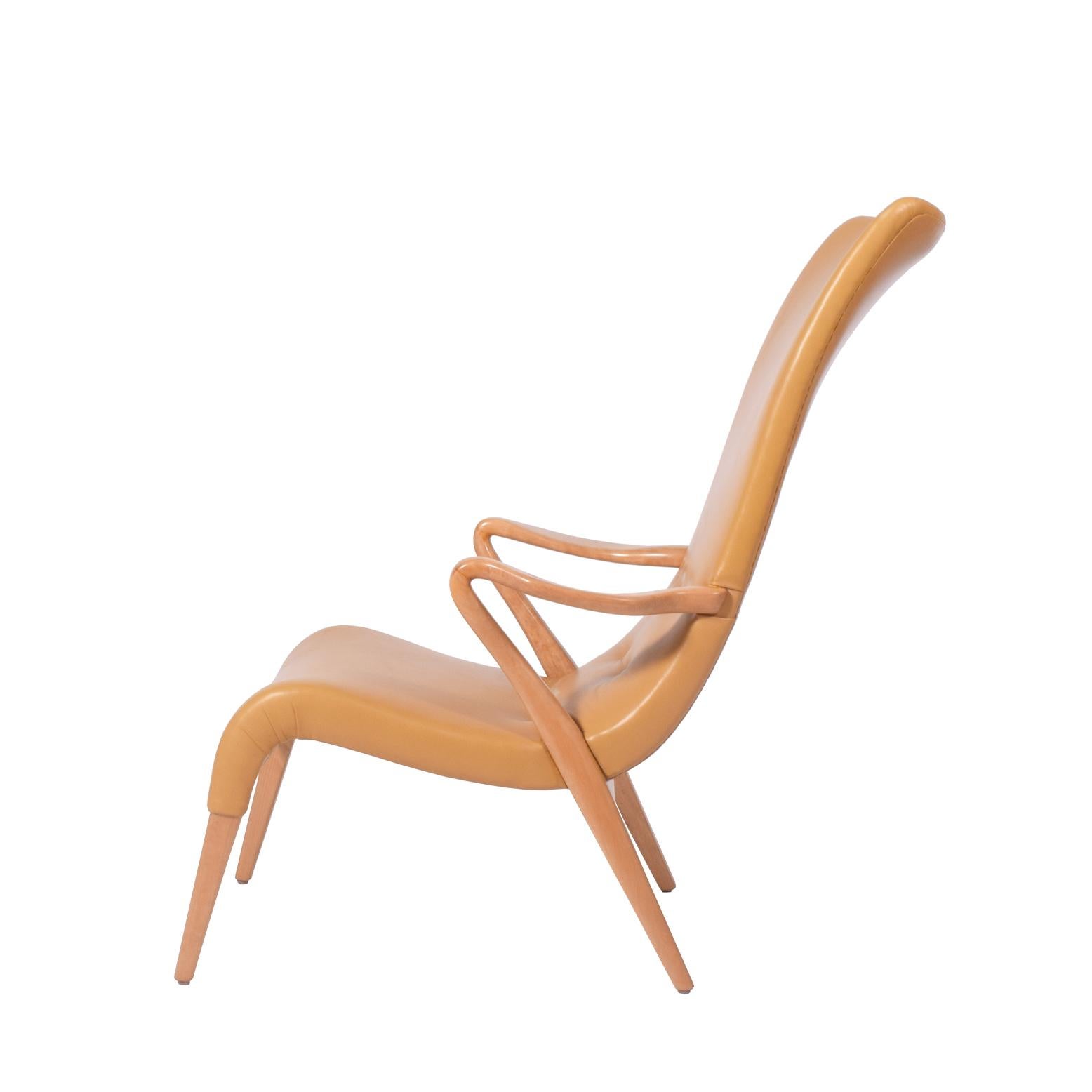 Designed in 1937, this Axel Larsson easy chair is a freeform sculpture with a solid birch frame. Model #1207. Originally designed for a hotel in Stockholm. Includes stamp on the inside frame SMF. This particular model was exhibited at the Swedish