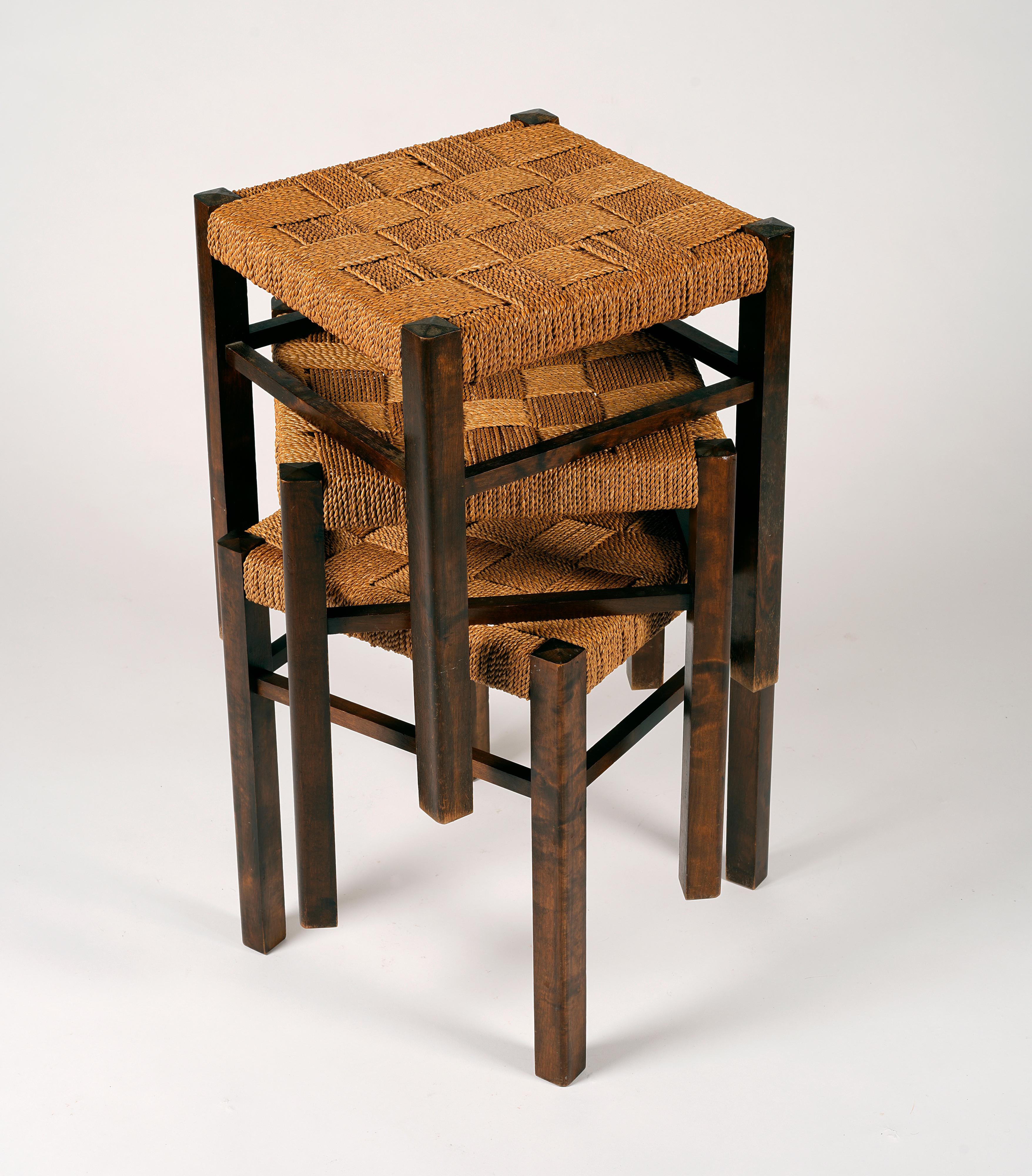 Stained Axel Larsson, set of three stools in stained birch and woven seagrass, 1930s For Sale