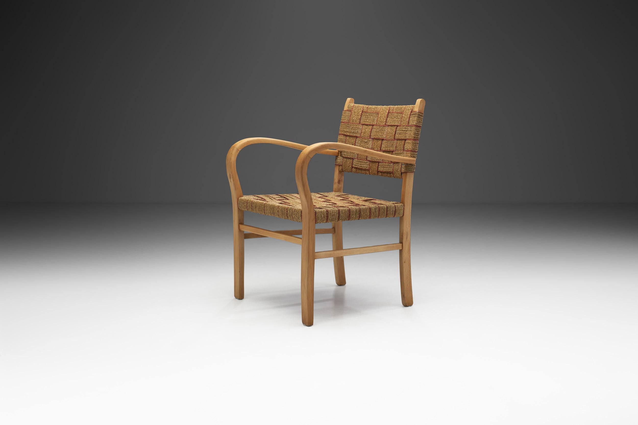 This functional armchair model by Swedish designer Axel Larsson, who was an incredibly productive Swedish furniture architect and designer with a more than 50-year long career. Despite Larsson being most well-known for his furniture series designed