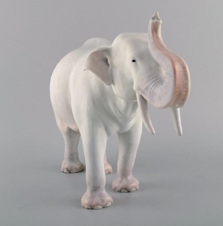 Axel Locher for Royal Copenhagen. Large and rare porcelain figure. Elephant. Model number 1373. 
Early 20th century.
Measures: 16 x 13.5 cm.
In excellent condition.
Stamped.
2nd factory quality.