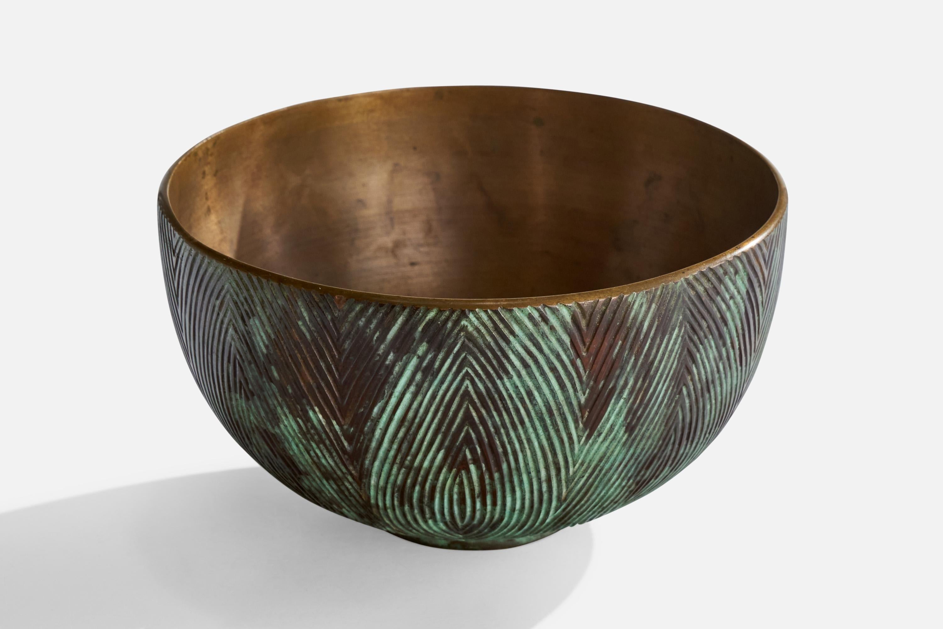 An incised bronze bowl designed and produced by Axel Salto, Denmark, dated 1950.