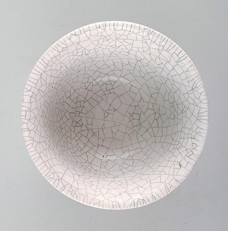 Axel Salto for Royal Copenhagen. Crackled / Craquelé bowl in glazed stoneware. White glaze. 1940s.
Signed: Salto.
In good condition. First factory quality.
Measures: 16 x 8.5 cm.