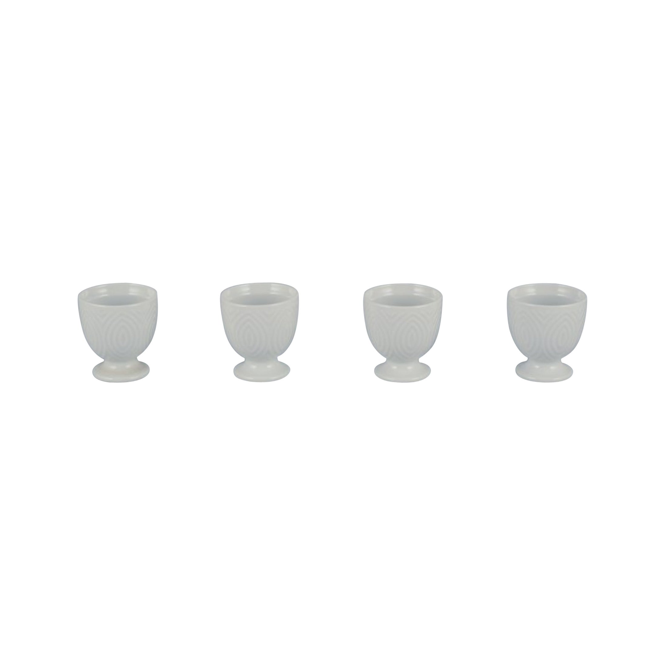 Axel Salto for Royal Copenhagen. Four egg cups in white porcelain.