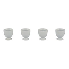 Axel Salto for Royal Copenhagen. Four egg cups in white porcelain.
