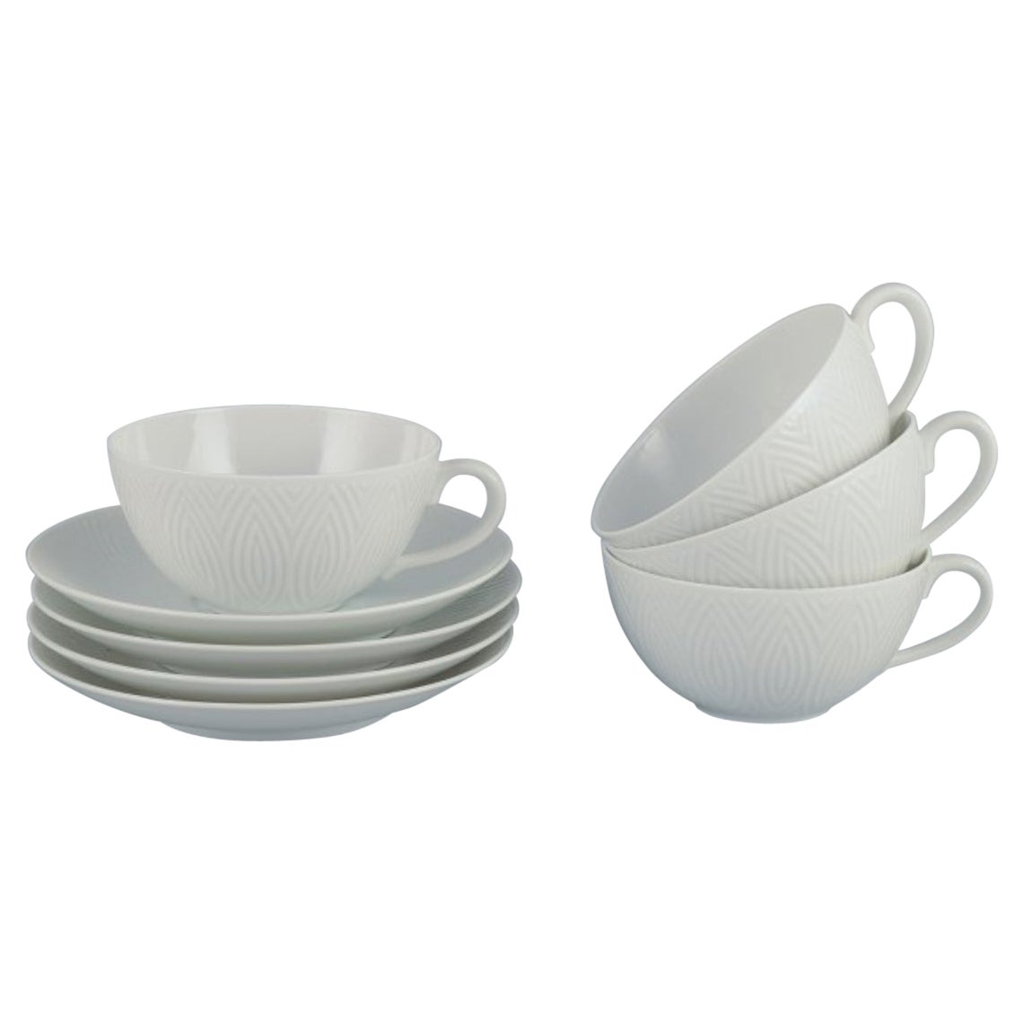 Axel Salto for Royal Copenhagen. Four pairs of teacups in white porcelain.