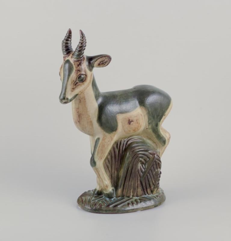 Art Deco Axel Salto for Royal Copenhagen. Large and impressive ceramic sculpture of deer For Sale