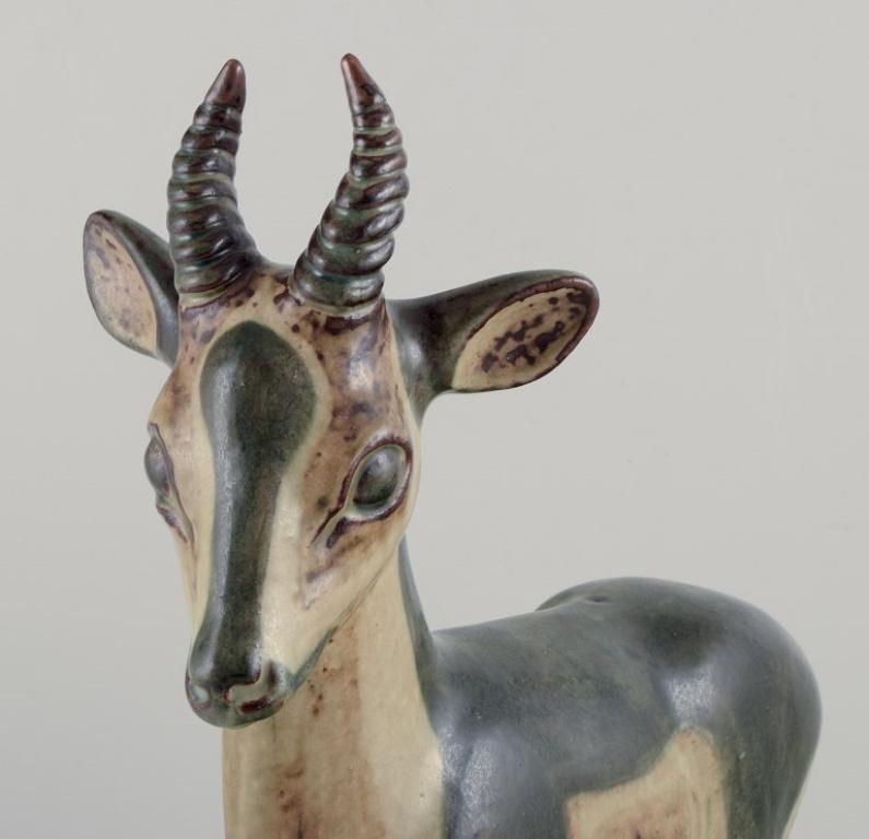 Danish Axel Salto for Royal Copenhagen. Large and impressive ceramic sculpture of deer For Sale
