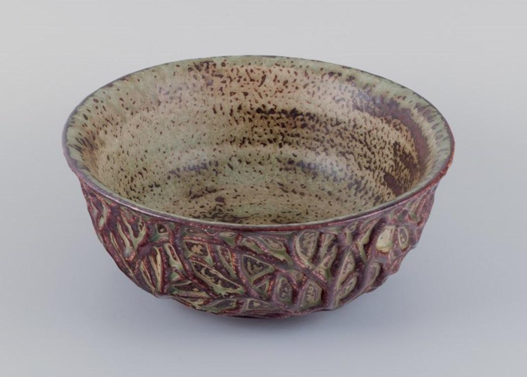Scandinavian Modern Axel Salto for Royal Copenhagen. Large ceramic bowl designed with leaf patterns  For Sale