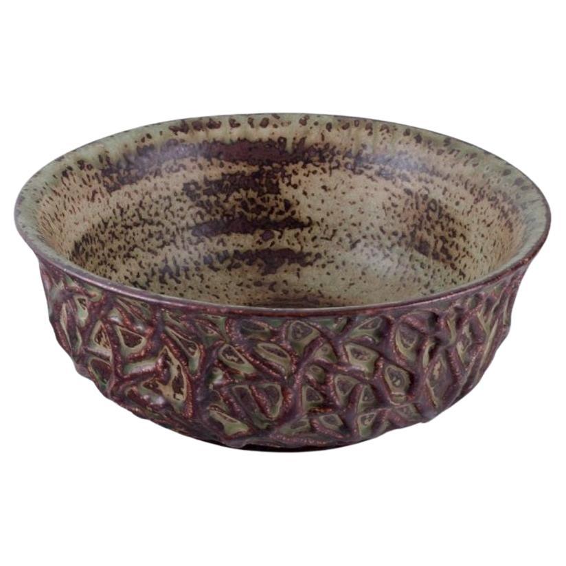 Axel Salto for Royal Copenhagen. Large ceramic bowl designed with leaf patterns  For Sale