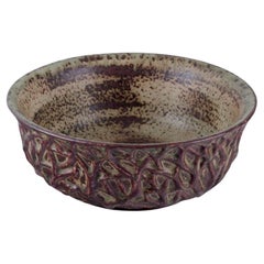 Axel Salto for Royal Copenhagen. Large ceramic bowl designed with leaf patterns