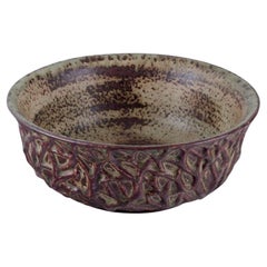 Vintage Axel Salto for Royal Copenhagen. Large ceramic bowl designed with leaf patterns 