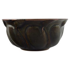 Axel Salto for Royal Copenhagen. Stoneware bowl in aubergine-colored tones
