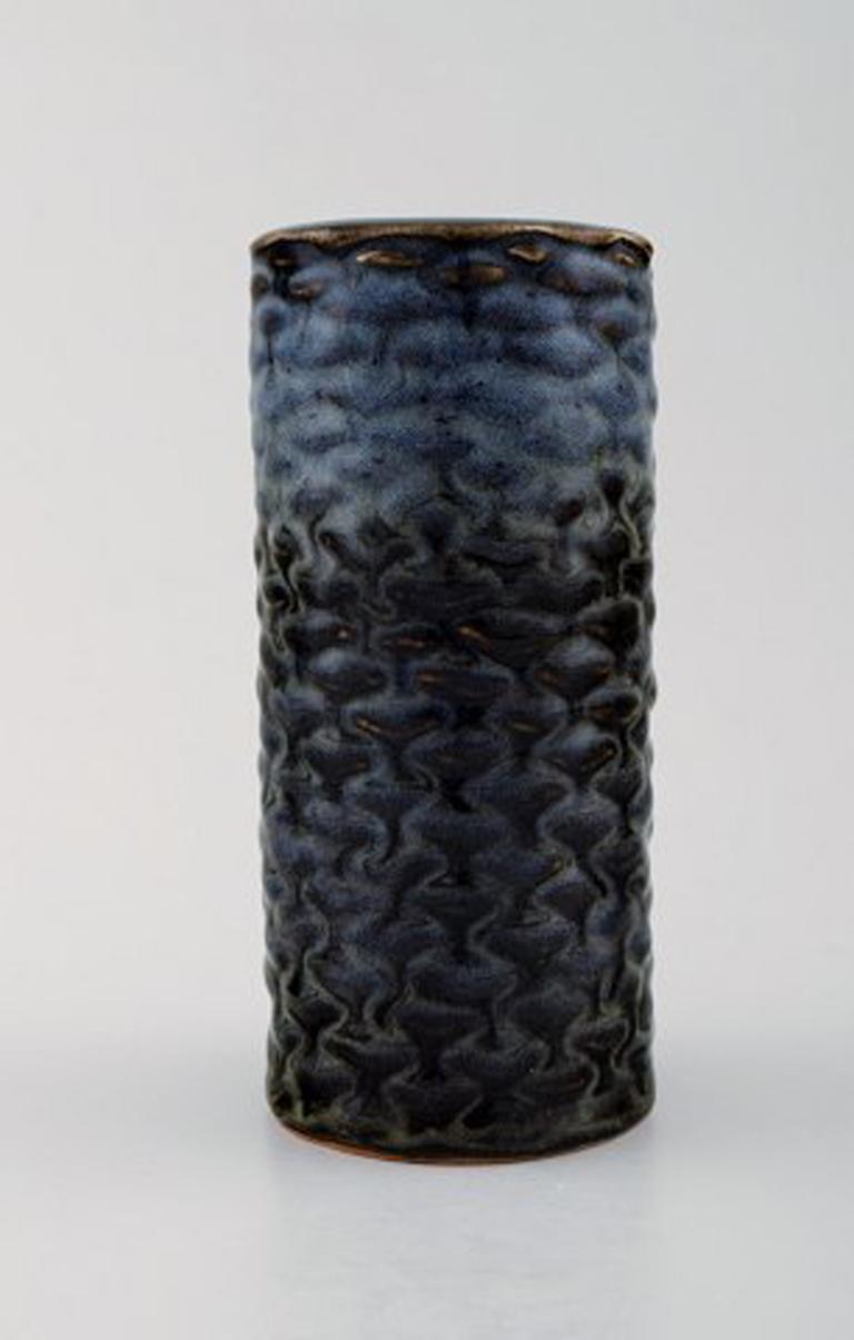 Axel Salto for Royal Copenhagen stoneware vase modeled with buds in relief, decorated with blue mussle glaze. Budding style.
Signed Salto. Number 20565.
In perfect condition. 2nd. factory quality.
Measures 16 cm. x 7 cm.