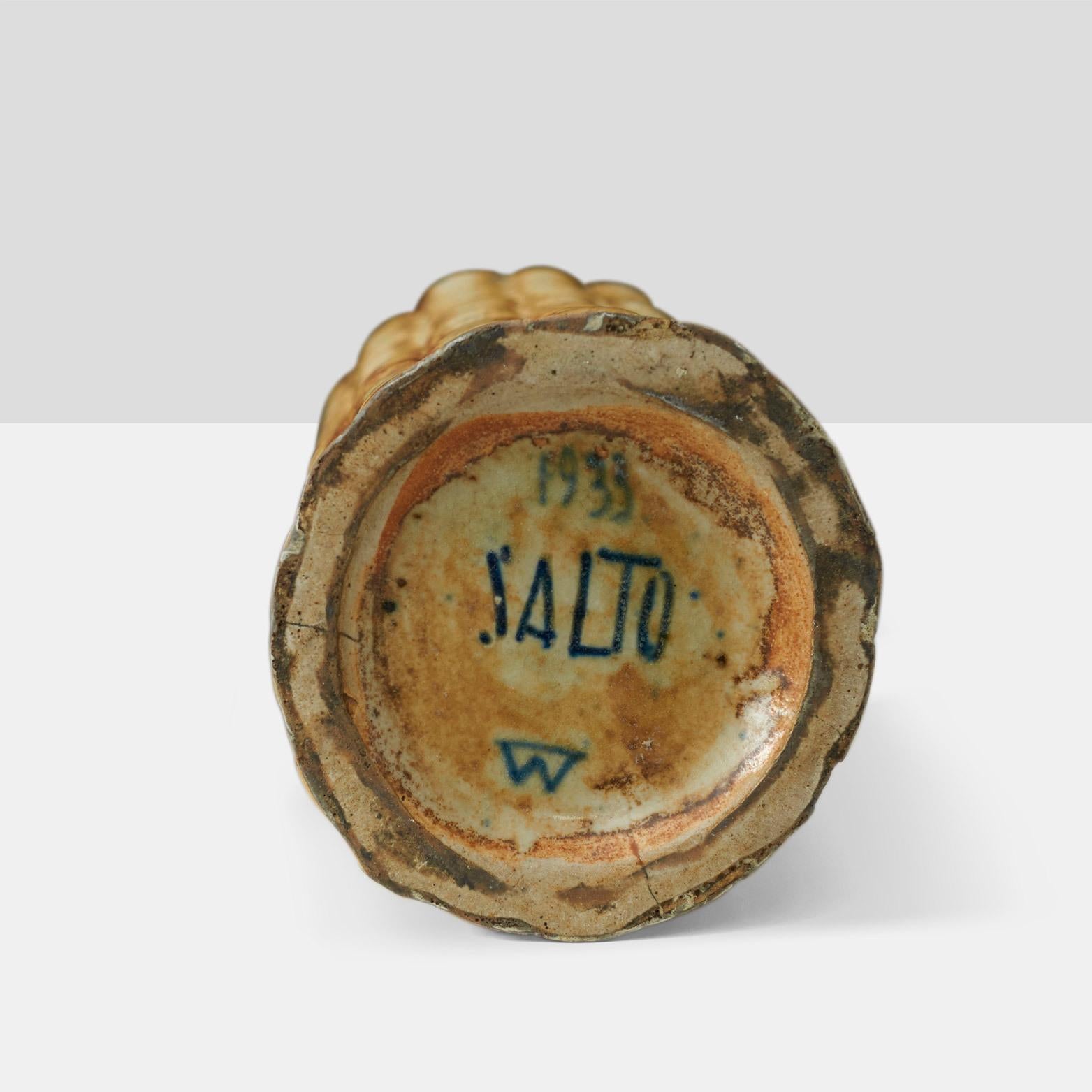 An Iconic Salto bud vase form in Sung glaze, incised with three line wave mark (Salto 20564) with stamped manufacturer’s mark to underside: [Royal Copenhagen Denmark 1933] and the signature of the designer.