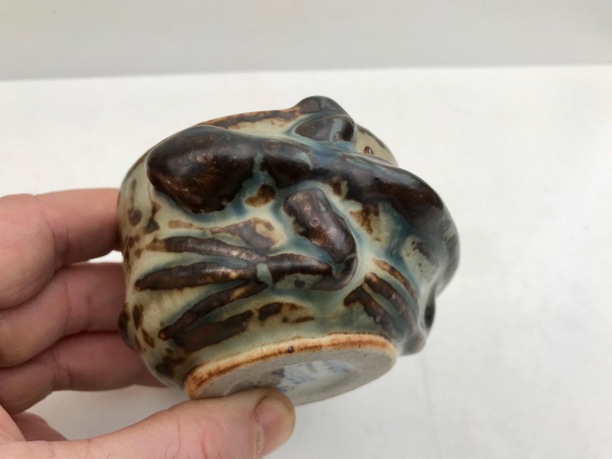Small stoneware vase with earthy glazes and integrated Salamander in Relief. Designed by Axel Salto during the 1940s and manufactured in his workshop at Royal Copenhagen. This vase is the highest grade possible at RC: grade 1. It is signed Salto by