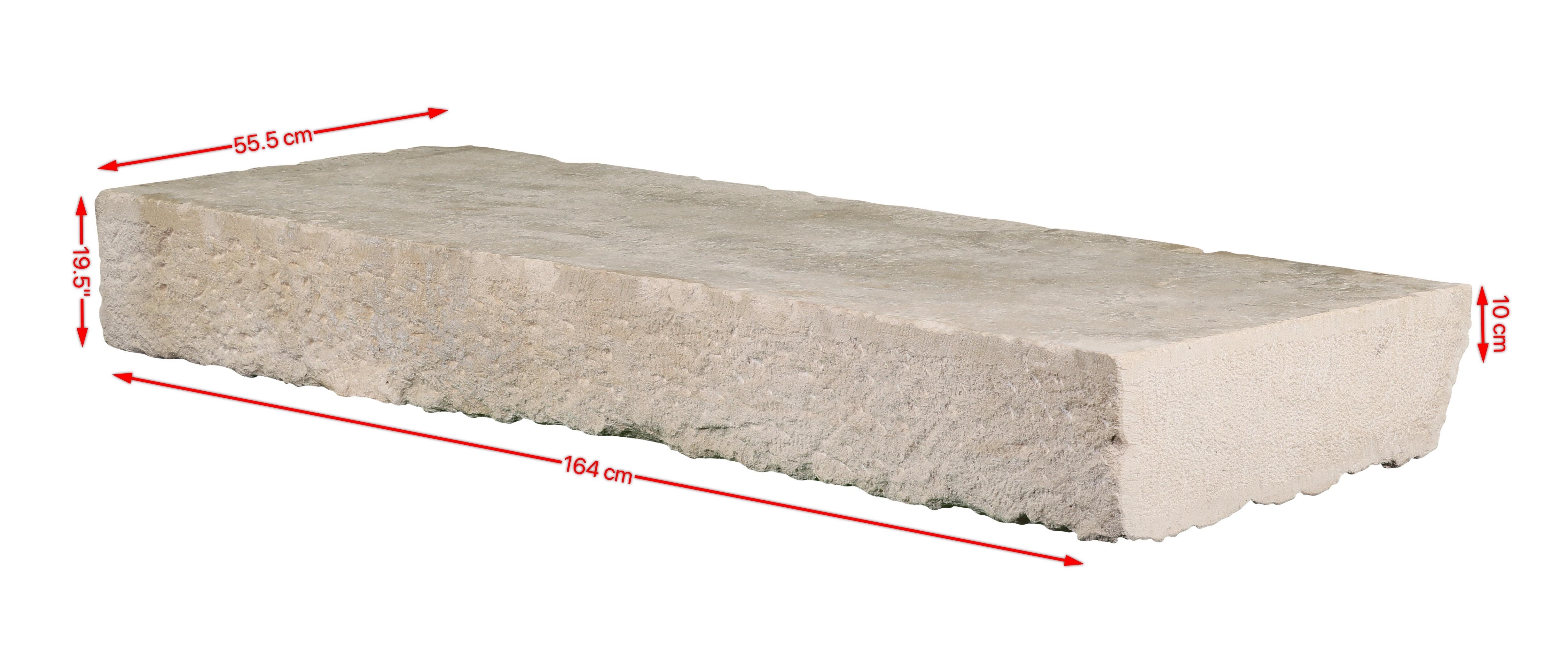 This solid base stone is a striking piece of off-white French limestone, perfect for those who appreciate the timeless elegance of Axel Vervoordt’s aesthetic. The rectangular, reclaimed limestone bears the mark of original artempo wear, giving it an