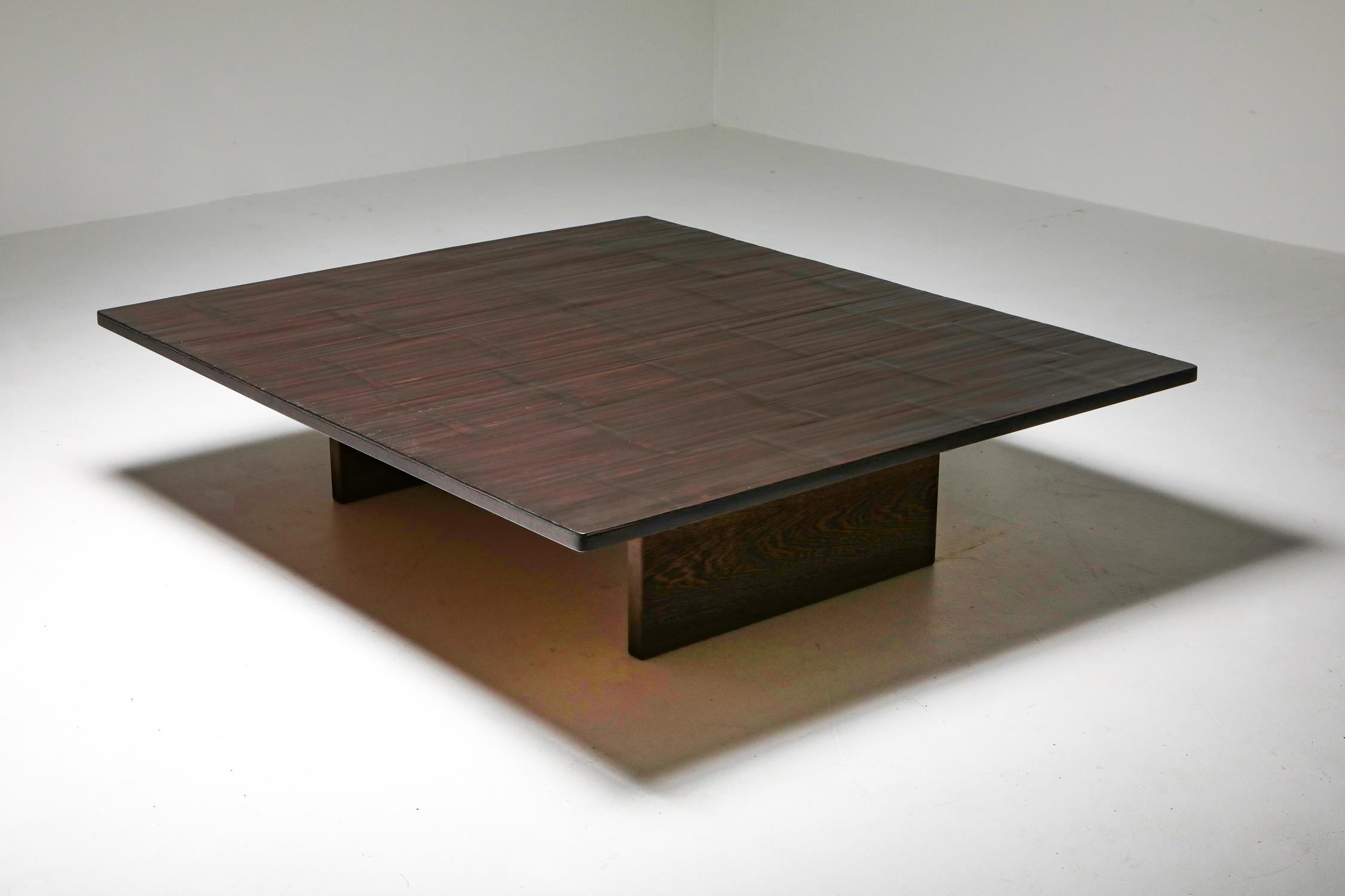 Axel Vervoordt, Belgium 1980, coffee table in solid wengé and bamboo.

Conceived and produced by the great Belgian decorator & art dealer in the 1980s.
Rolls of bamboo were ordered in China to top these custom designed coffee tables. Through this