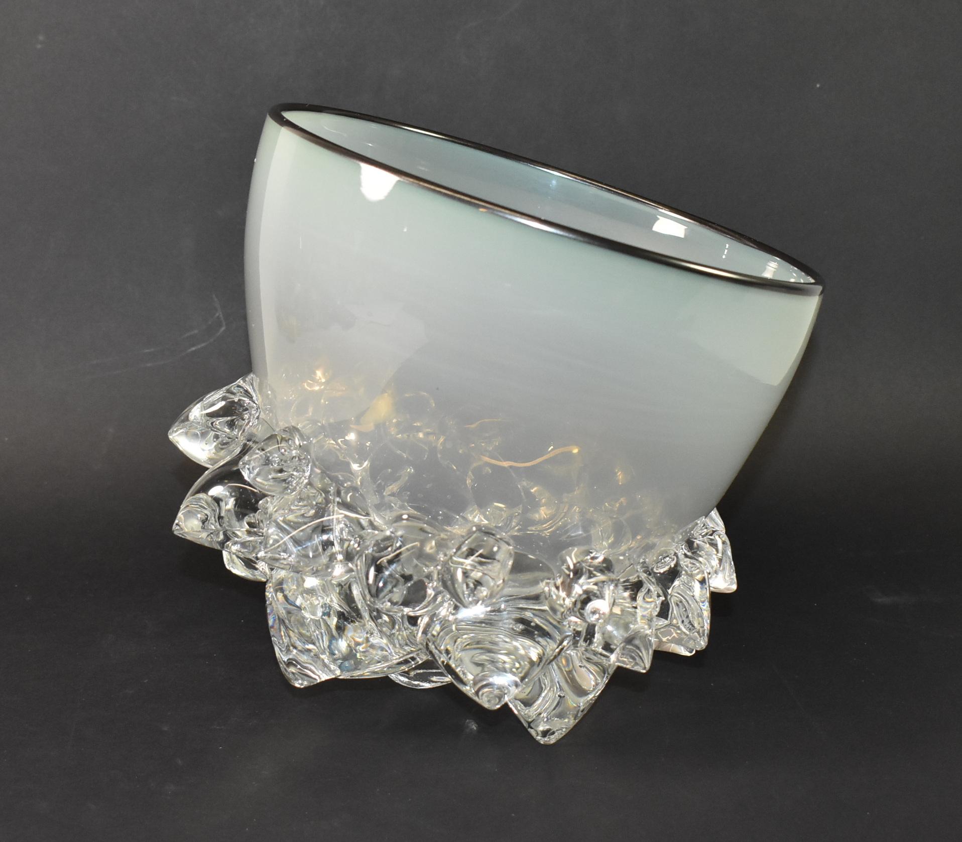 Stunning Andrew Madvin hand blown opal white glass thorn bowl from Axiom Glass. This piece is an outstanding example of Anrdew Madvin's unique and unusual thorn bowl, which is created by blowing the bowl and then attaching more than a dozen clear