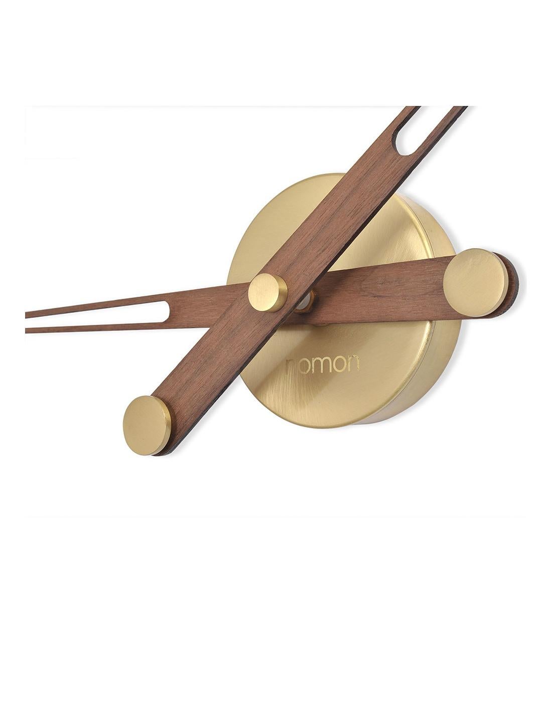 This Axioma G clock features a polished brass box and hands in walnut . The clock mechanism used is UTS Quartz
Axioma G wall clock :Box in polished brass, hands in walnut.
Each clock is a unique handmade piece
California residents: Prop 65