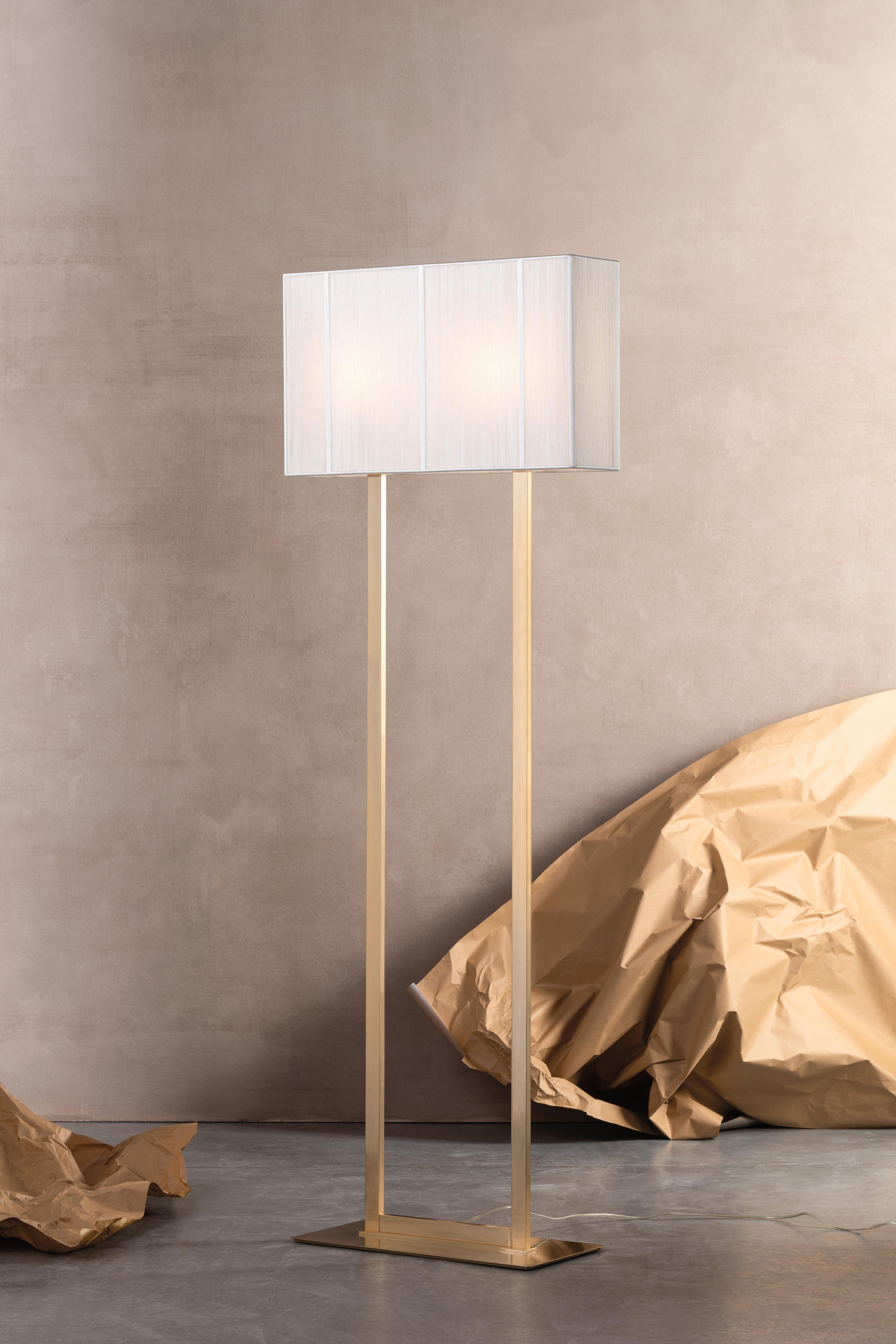 Axolight Clavius Medium Floor Lamp in White Lampshade and Chrome Finish by Manuel & Vanessa Vivian 

Admire the texture of a precious hand-made silken thread lampshade. Clavius expresses its refined elegance by radiating softness and atmosphere