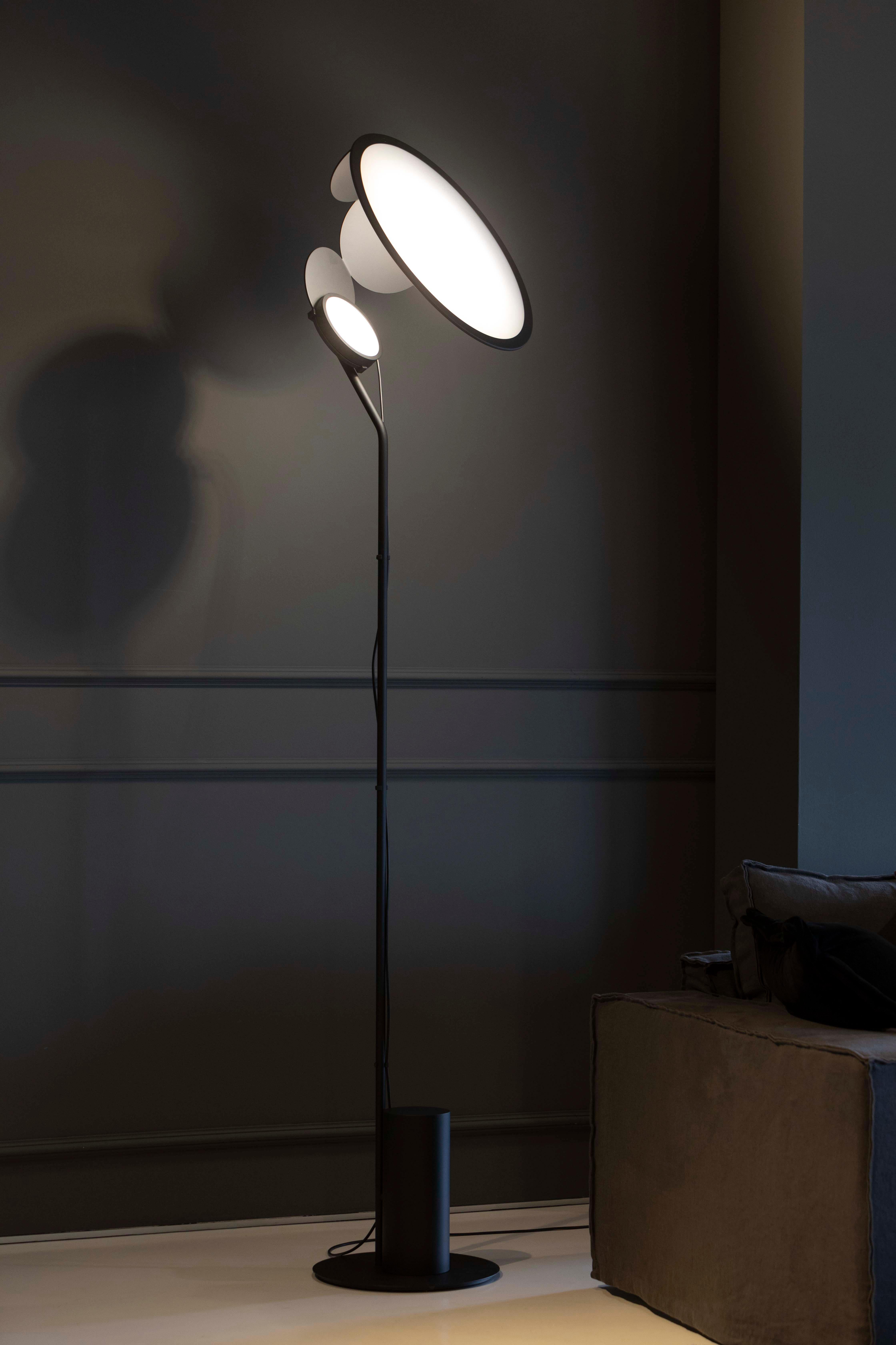 Axolight Cut Medium Floor Lamp in Intense Black by Timo Ripatti

Softness of the atmosphere and personalization of orientation. Cut expresses a refined design and an emotional light which does not dazzle, but wraps gently.

Cut is the result of a